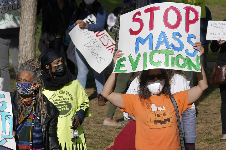 Protesters call for support for tenants and homeowners at risk of eviction during a demonstration on Oct. 11 in Boston. A federal moratorium on evictions is set to expire at the end of December. (Steven Senne/AP)