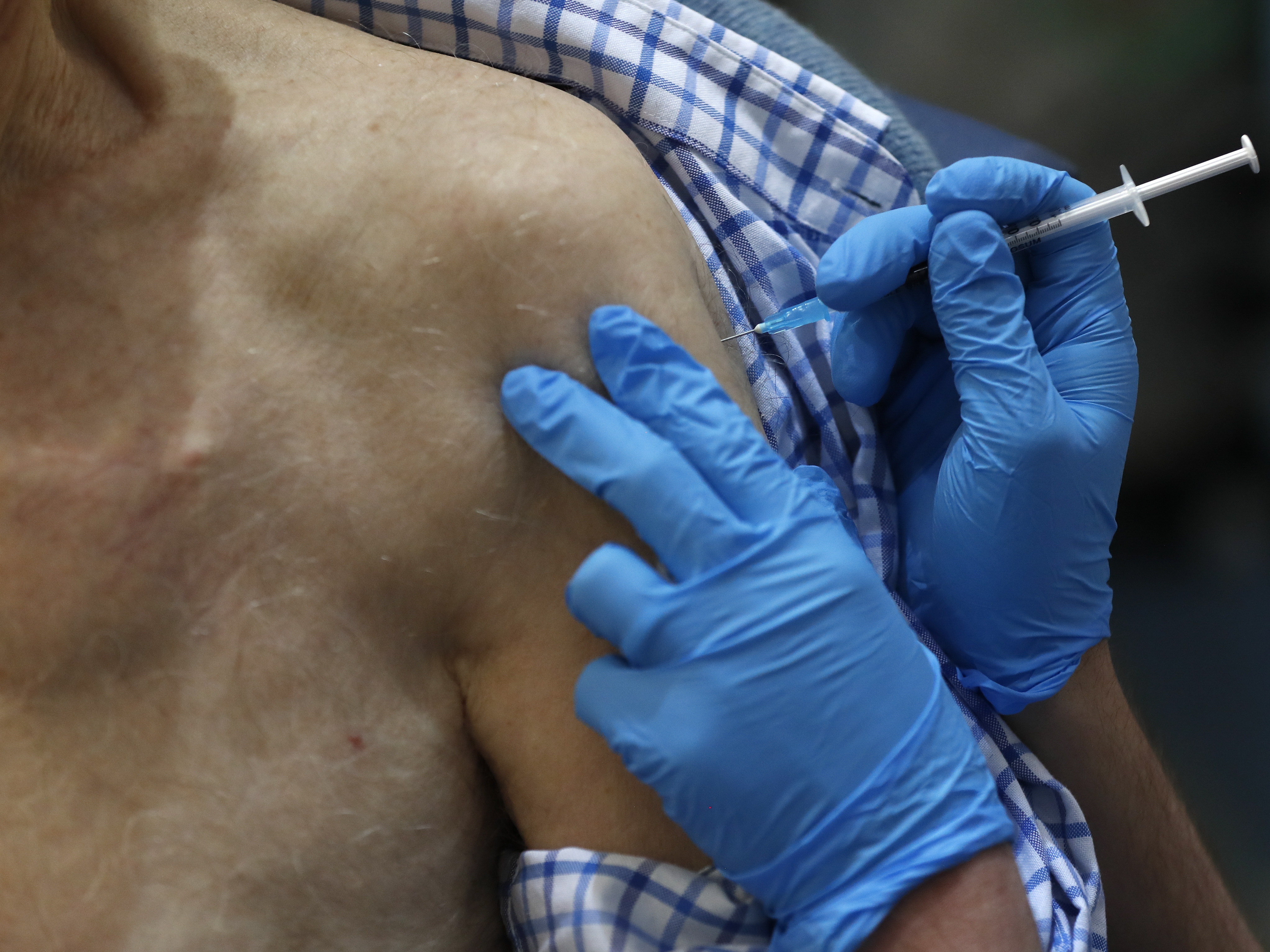 The U.K. launched its largest-ever immunization program Tuesday. Health officials began dispensing doses of the Pfizer and BioNTech coronavirus vaccine, first vaccinating health care workers and residents over the age of 80. (Getty Images)