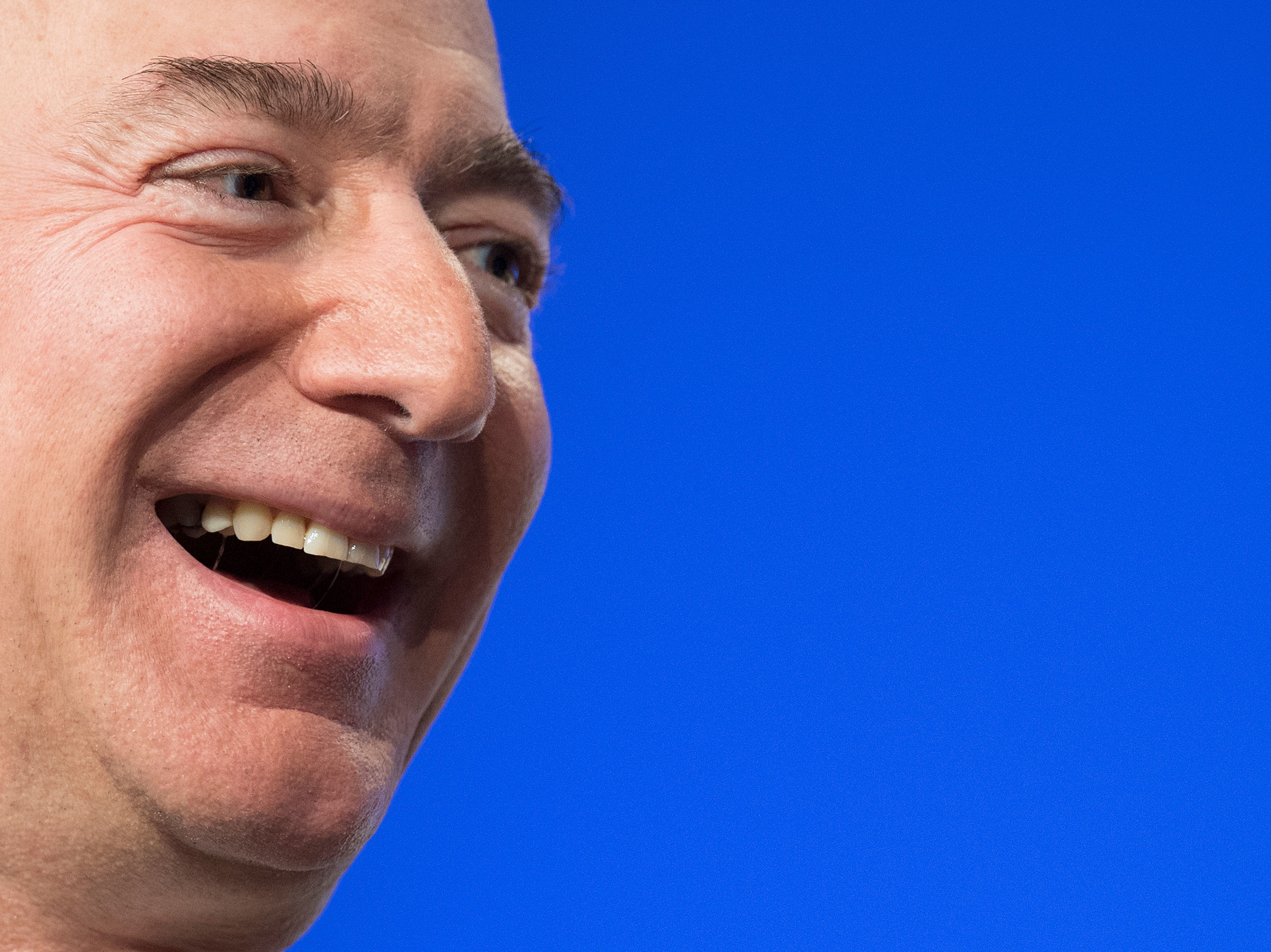 Amazon founder Jeff Bezos is the world's wealthiest person, according to the latest Bloomberg Billionaires Index, with a net worth of $182 billion. Four others also have fortunes over $100 billion. Here, Bezos speaks at a conference in 2018. (AFP via Getty Images)