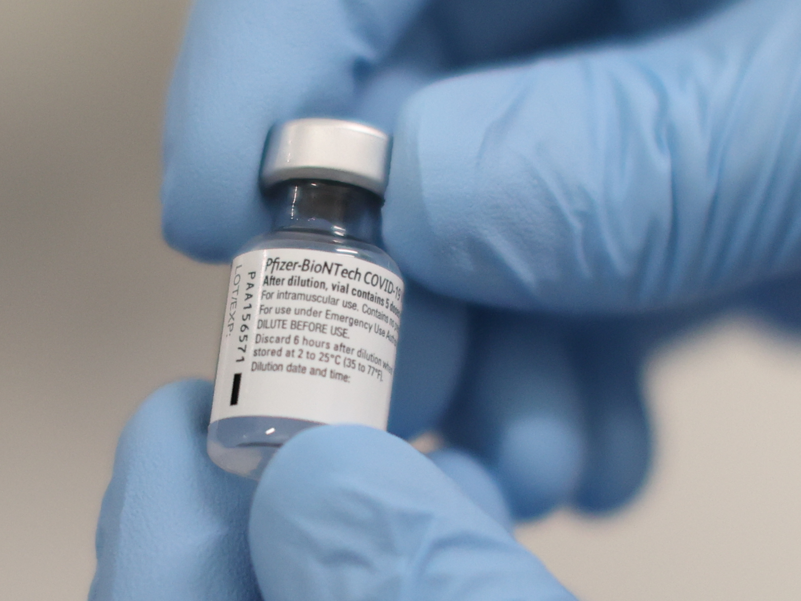 A vial of the COVID-19 vaccine developed by Pfizer and BioNTech that was used at the Royal Victoria Hospital in Belfast, U.K., on Tuesday. (Bloomberg via Getty Images)