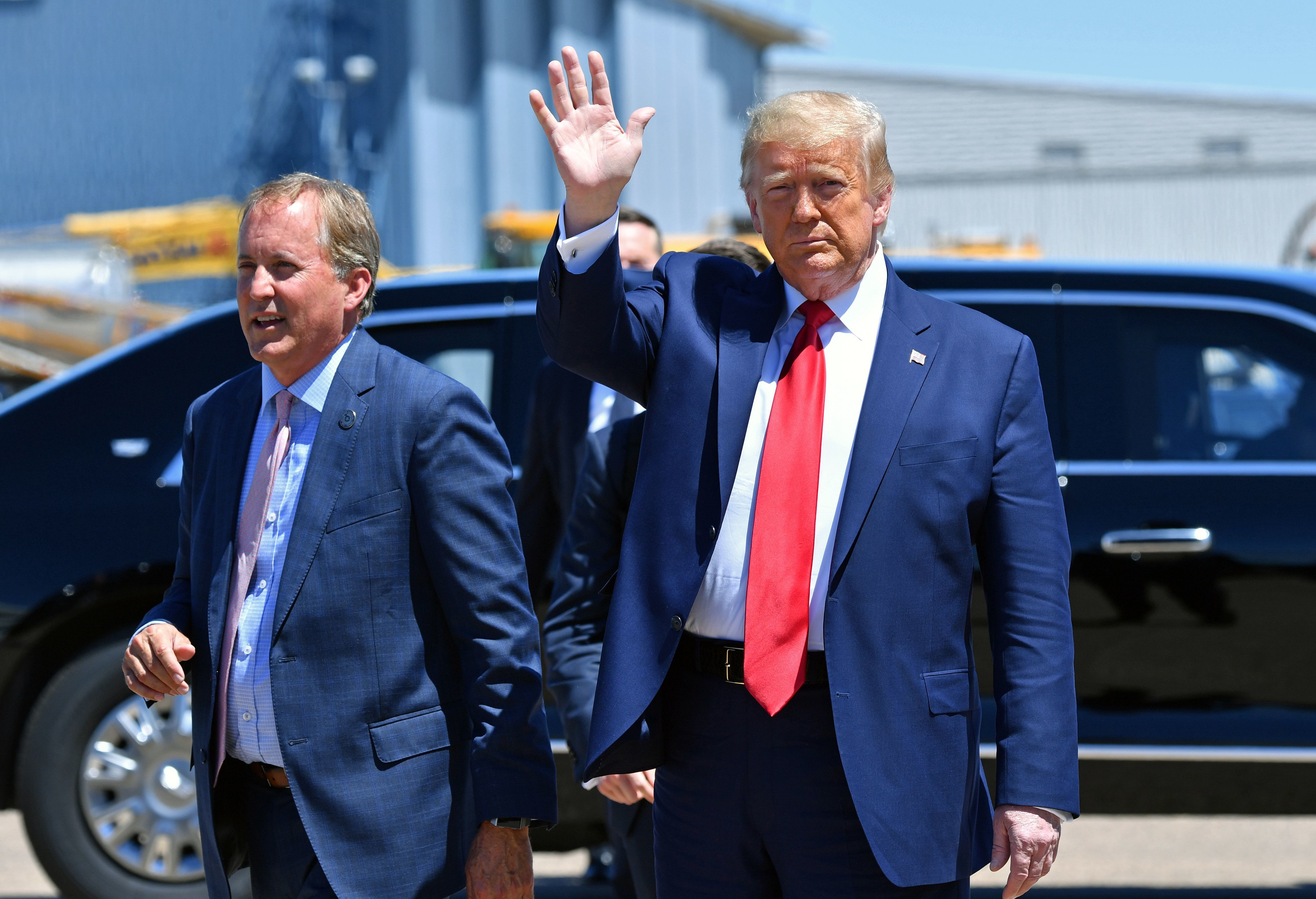 Texas Attorney General Ken Paxton, seen here with President Trump in June in Dallas, sued four states that Joe Biden carried in the general election, claiming their changes to election procedures during the pandemic violated federal law. (AFP via Getty Images)