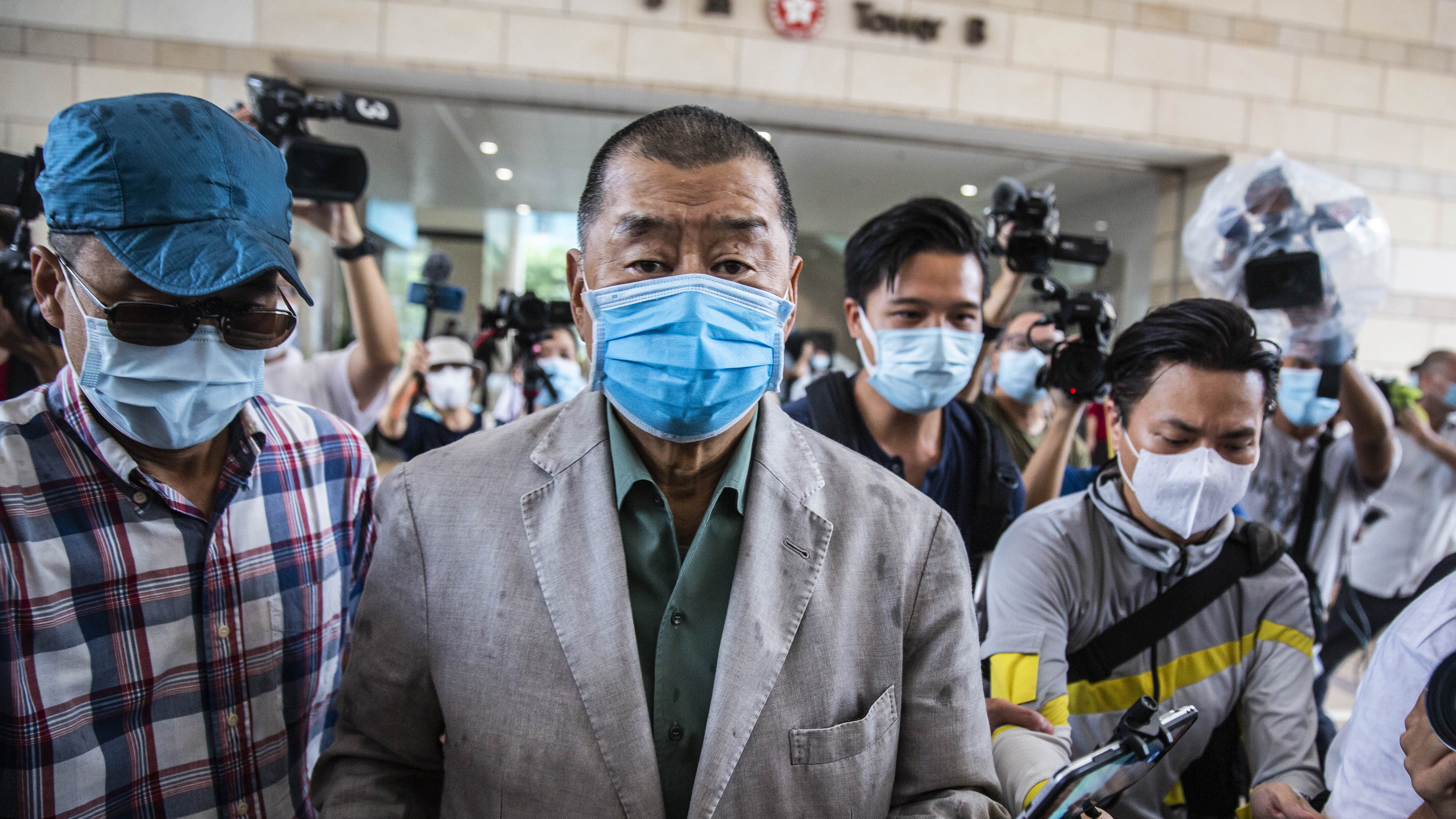 Hong Kong media mogul Jimmy Lai, seen here before a court hearing in September, has been formally charged under China