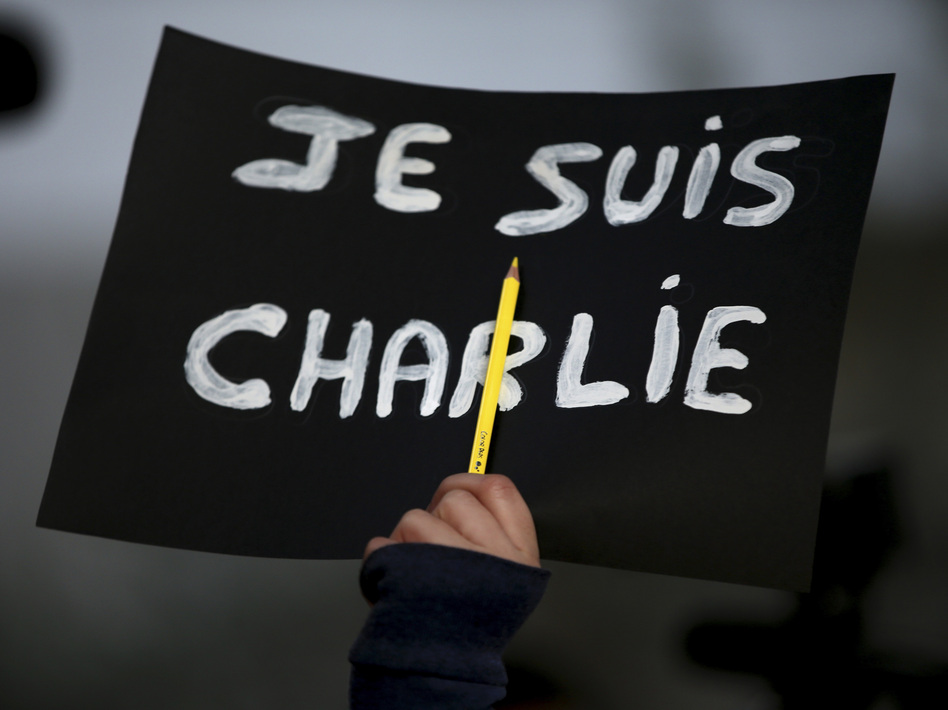 In the wake of the 2015 attack in Paris, "<em>Je Suis</em> Charlie" became a rallying cry for demonstrators grieving the victims at the controversial French publication <em>Charlie Hebdo</em>. On Wednesday, a French court found 14 individuals guilty of supporting the massacre. (Hussein Malla/AP)