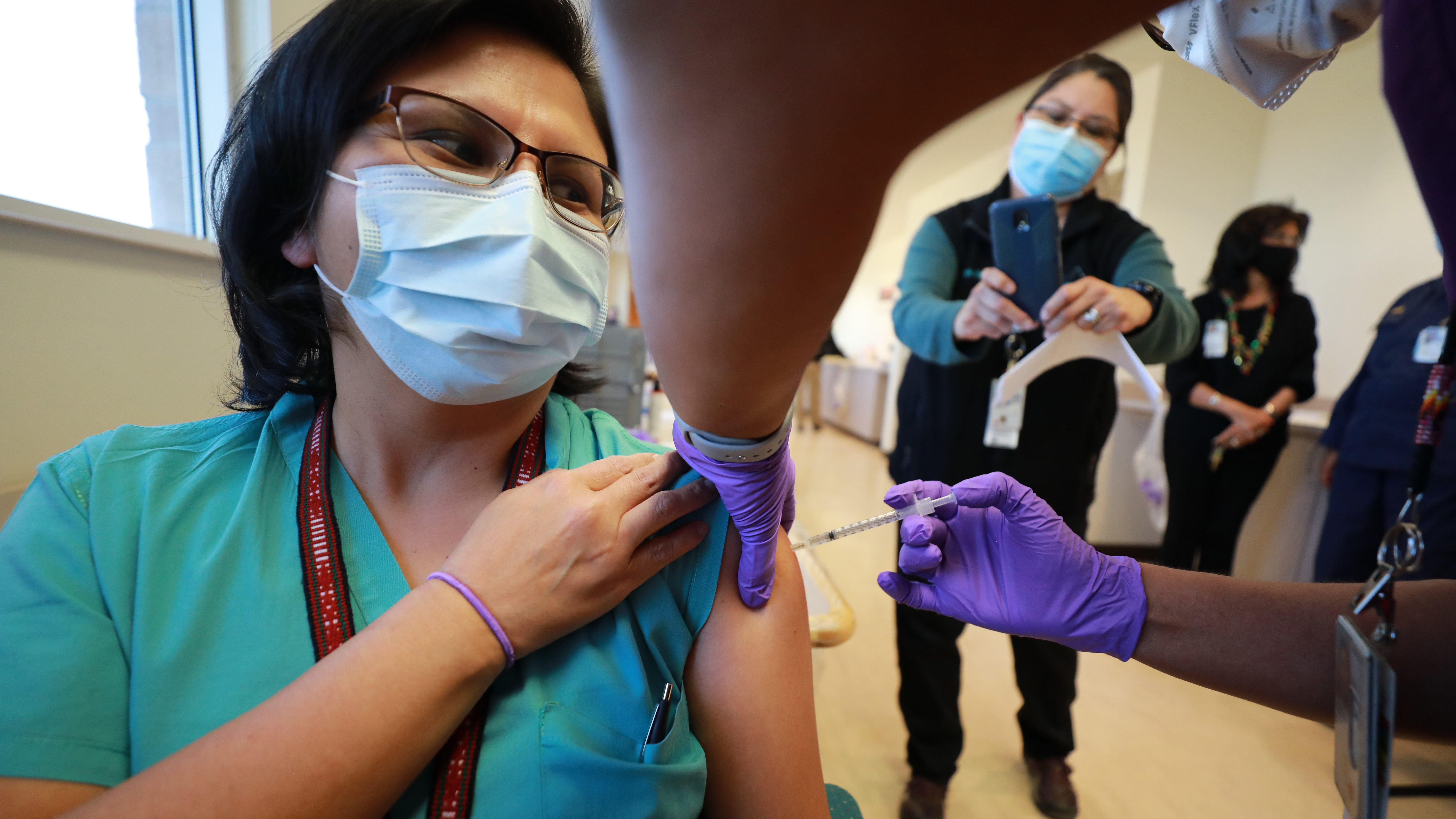 Dr. Lawanda Jim, Chair of Internal Medicine, receives a COVID-19 vaccine at Northern Navajo Medical Center on Tuesday in Shiprock, N.M. (Getty Images)