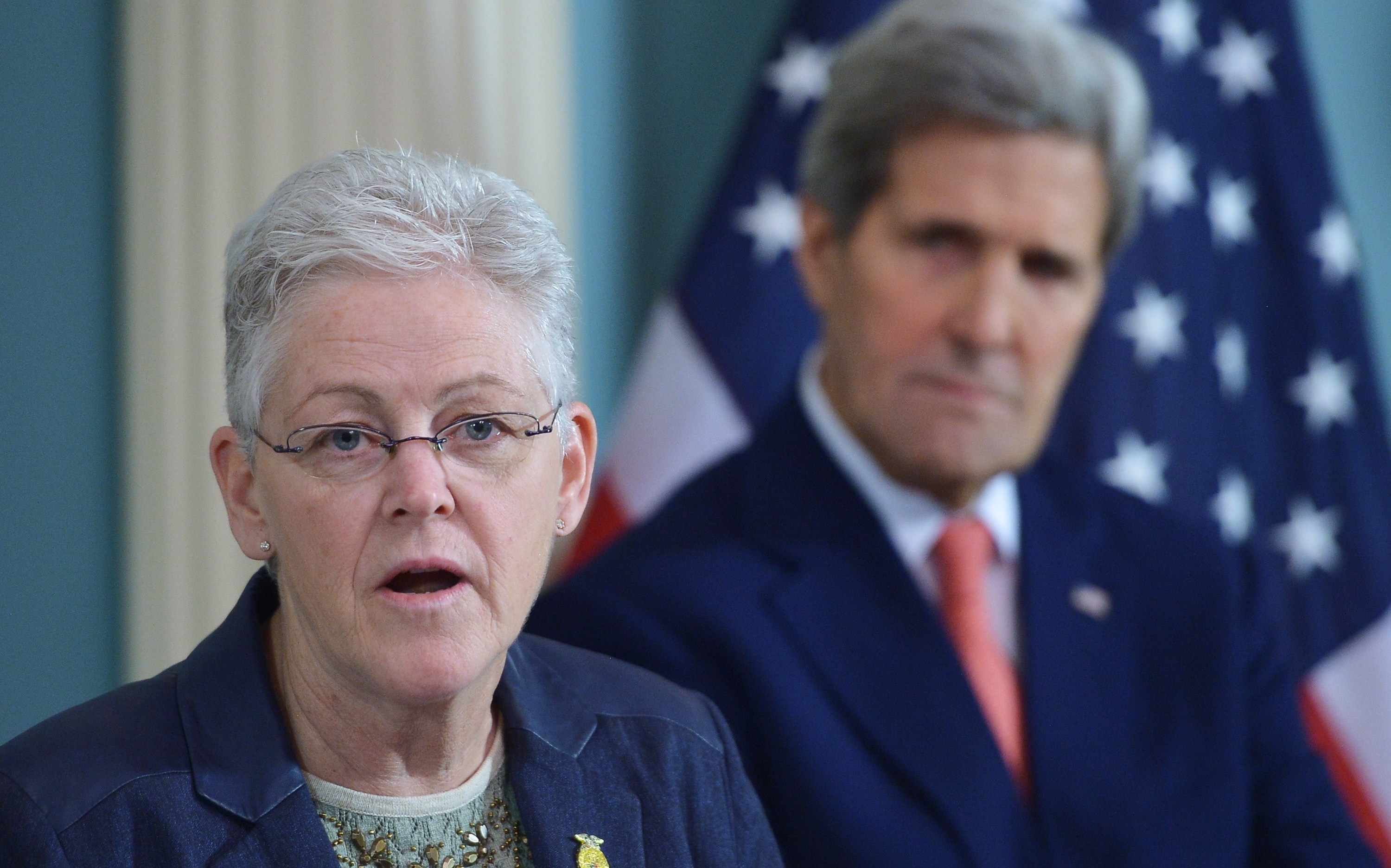 Then-Environmental Protection Agency Administrator Gina McCarthy speaks during a 2015 signing ceremony for an air quality agreement as then-Secretary of State John Kerry looks on. The two will be back together working on climate issues in the Biden administration. (AFP via Getty Images)
