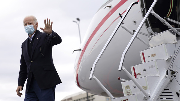 President-elect Joe Biden departs his plane before attending a drive-in rally for U.S. Senate candidates Jon Ossoff and Rev. Raphael Warnock.