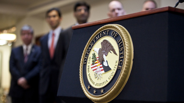 A U.S. Department of Justice seal is displayed on a podium during a news conference in 2012.