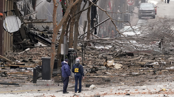 Emergency personnel work near the scene of an explosion in downtown Nashville on Friday. Law enforcement is seeking suspects, and the governor has asked for a federal emergency declaration.