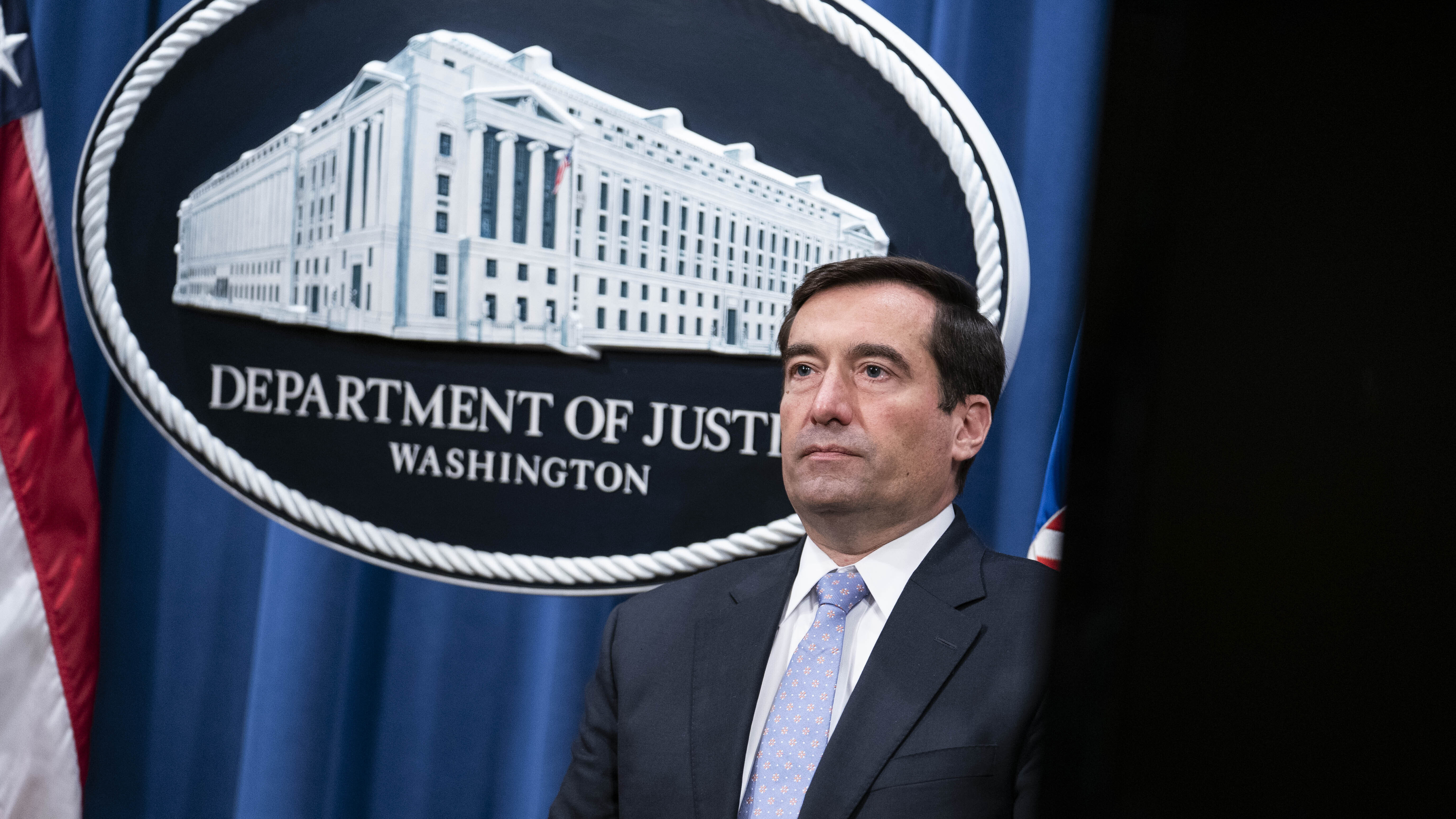 Assistant Attorney General for National Security John Demers listens during a virtual news conference at the Department of Justice on Oct. 28, 2020.