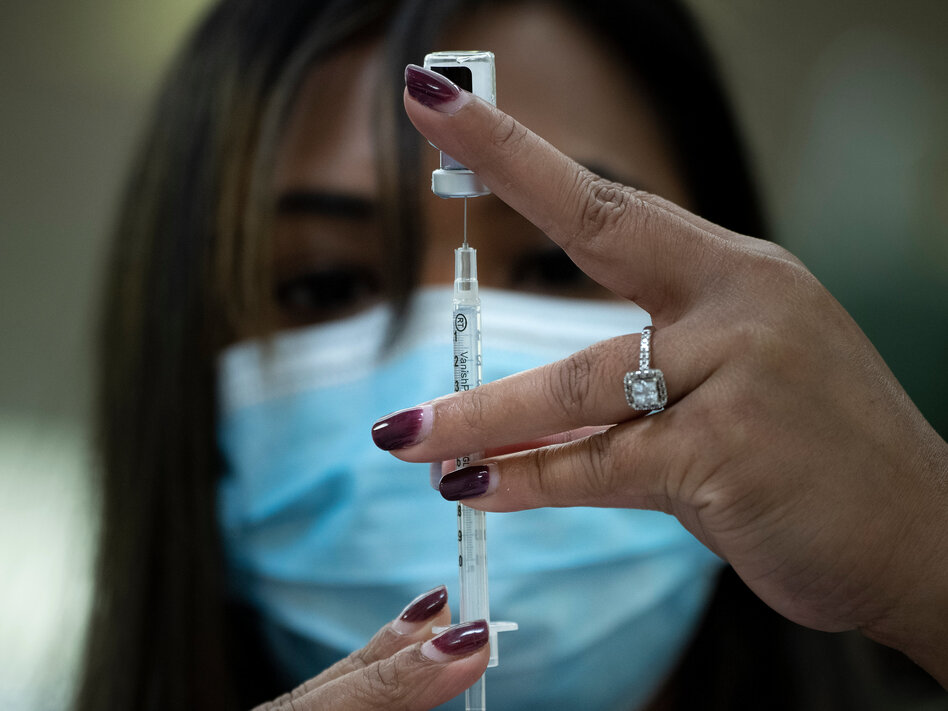 The U.S. is unlikely to meet its goal of vaccinating 20 million Americans by the end of the year, health officials said this week. (Brendan Smialowski/AFP via Getty Images)