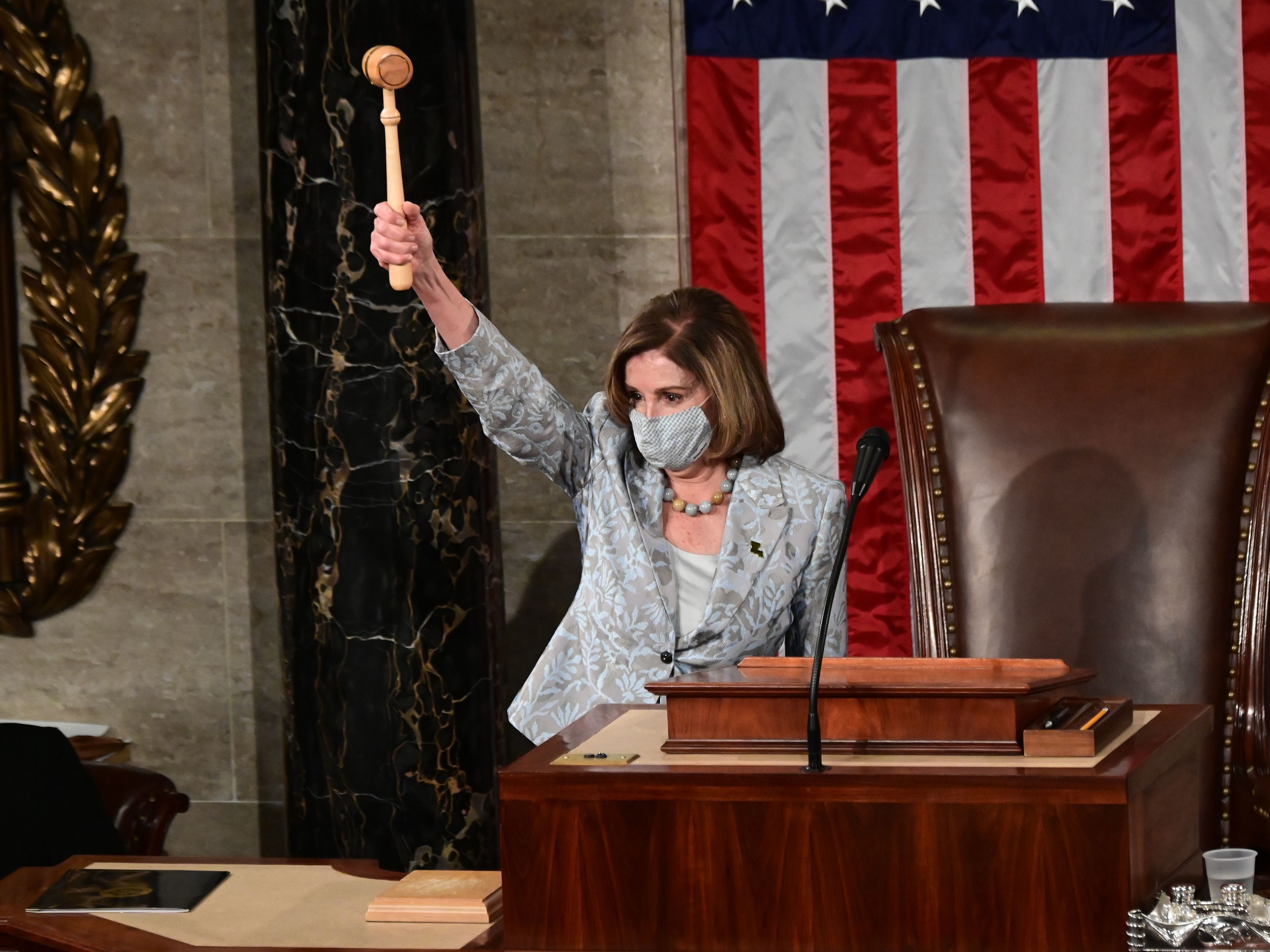 Pelosi Is Narrowly Reelected Speaker