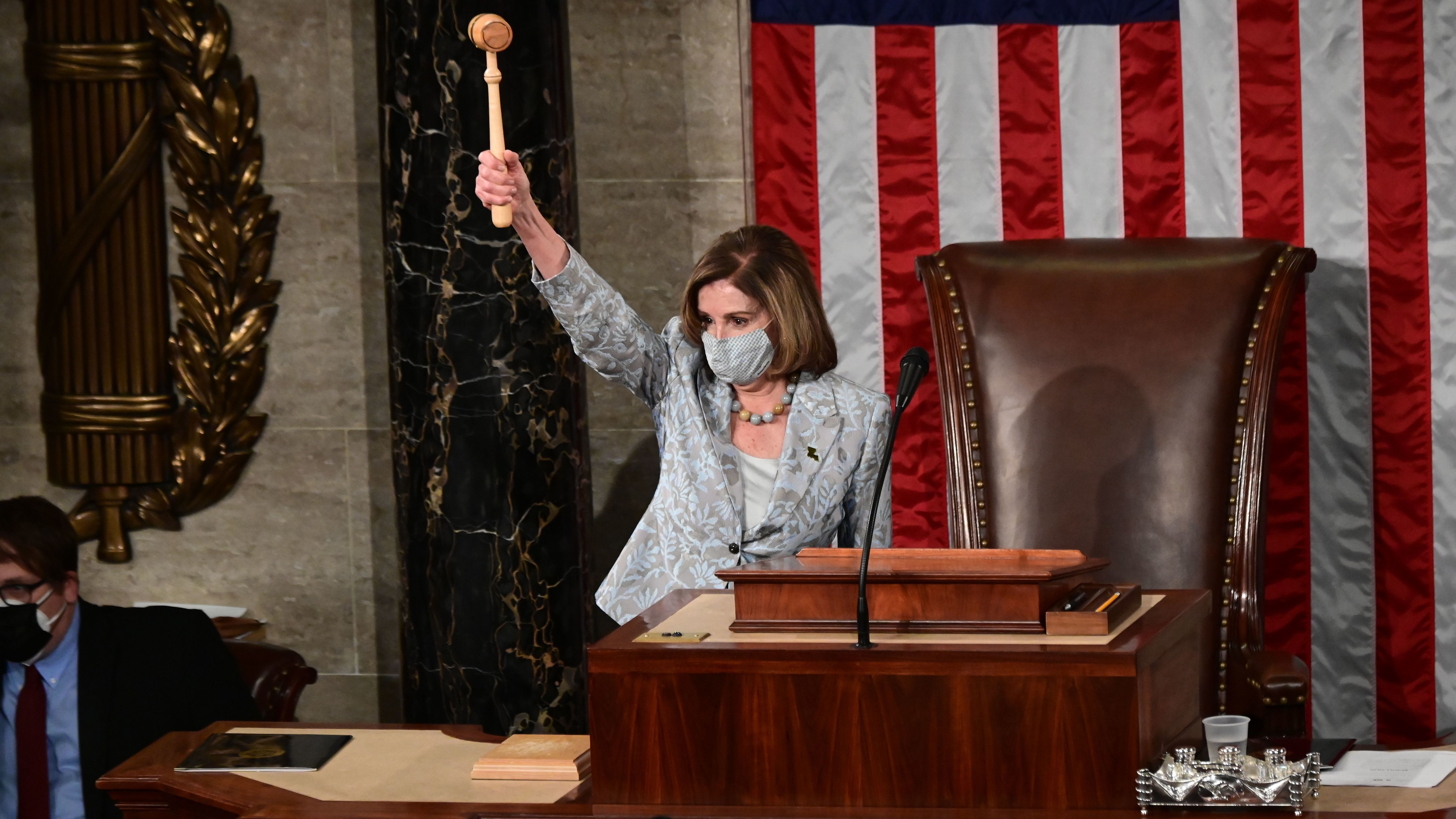 Pelosi Is Narrowly Reelected Speaker