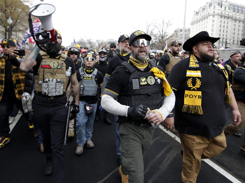 Demonstrators wearing clothes linked to the far-right extremist group Proud Boys attend a pro-Trump rally in Washington last month. (Luis M. Alvarez/AP)