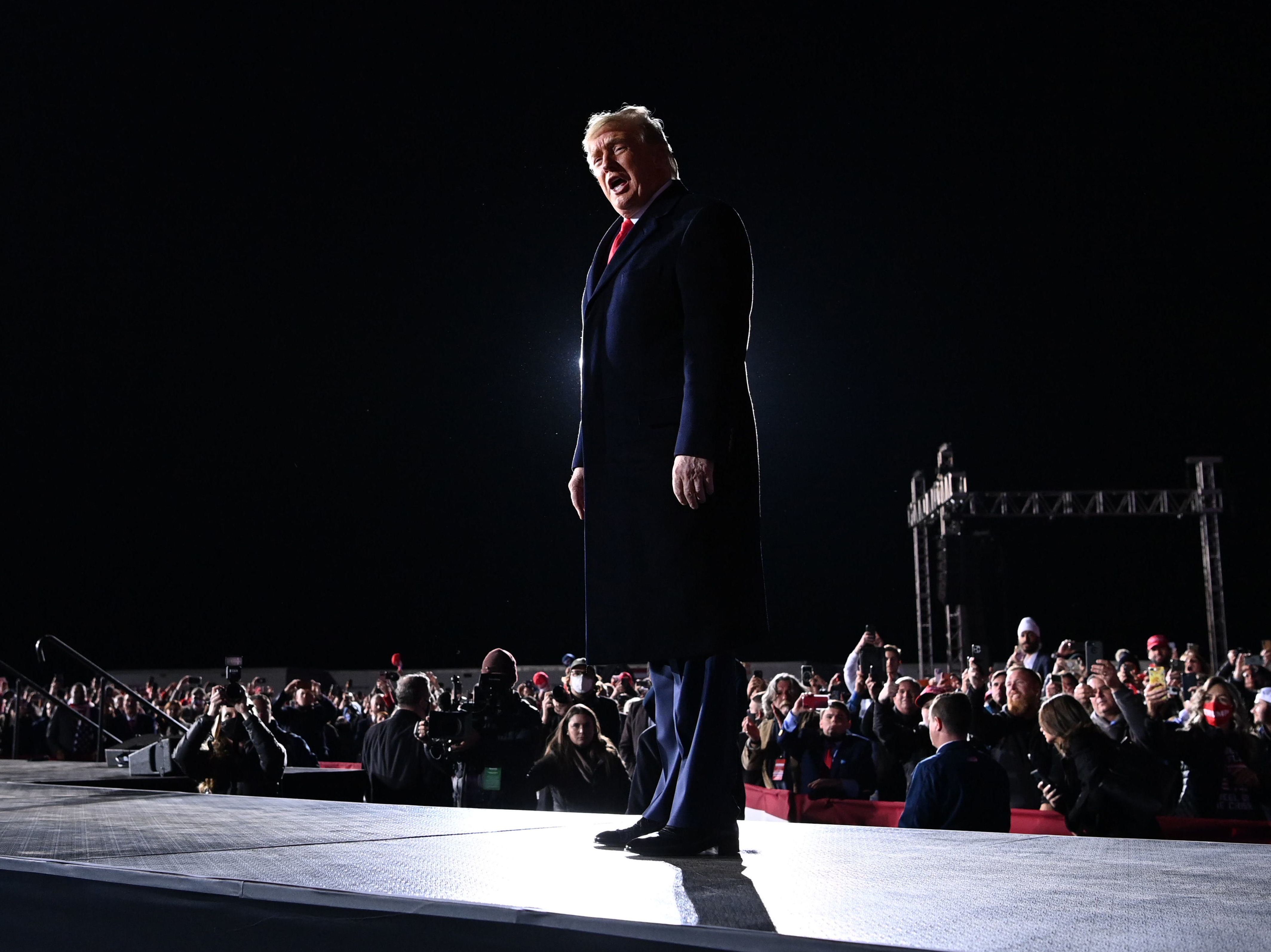 President Trump arrives at a rally in support of Republican incumbent Sens. Kelly Loeffler and David Perdue on Monday evening in Dalton, Ga. (AFP via Getty Images)