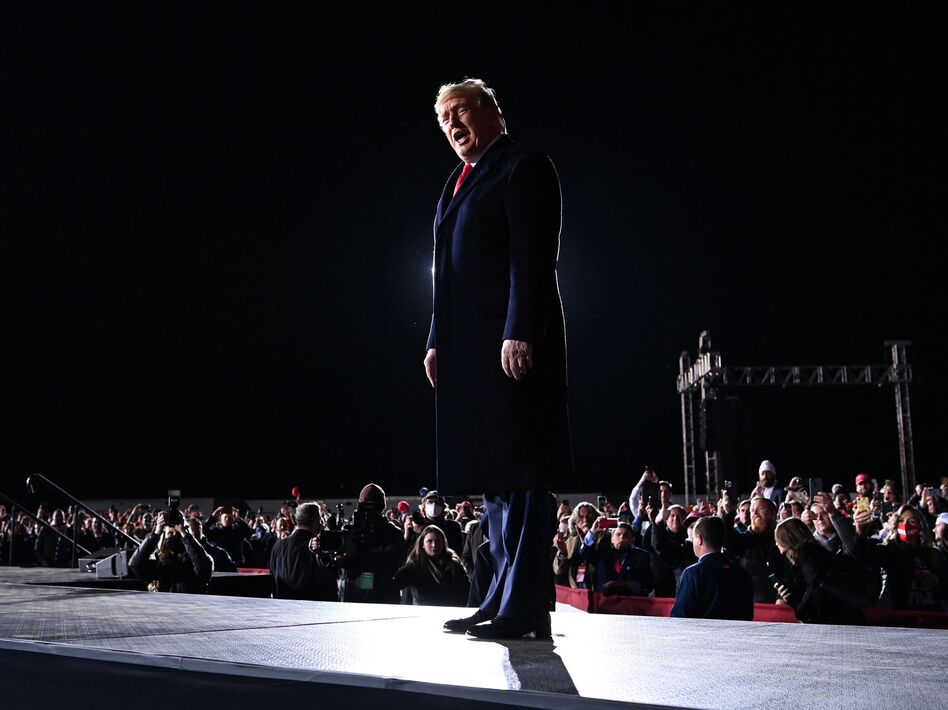 President Trump arrives at a rally in support of Republican incumbent Sens. Kelly Loeffler and David Perdue on Monday evening in Dalton, Ga. (Mandel Ngan/AFP via Getty Images)