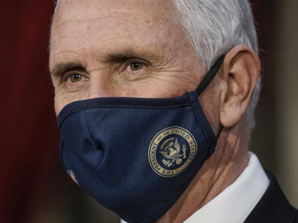 Vice President Pence finishes a swearing-in ceremony for senators Sunday at the U.S. Capitol. (J. Scott Applewhite/AP)