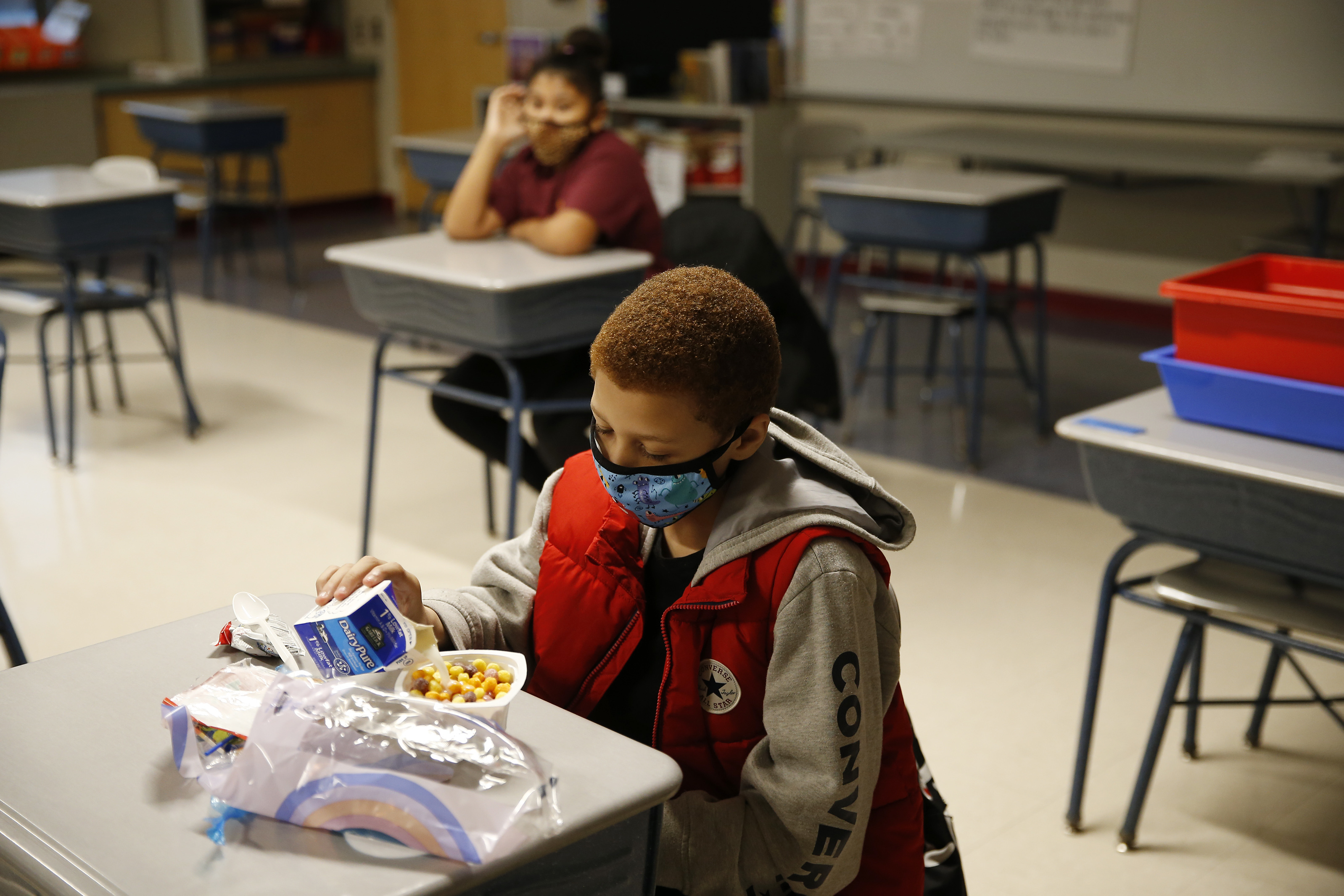 A fourth-grader eats breakfast at Mary L. Fonseca Elementary School in Fall River, Mass. (The Boston Globe via Getty Images)