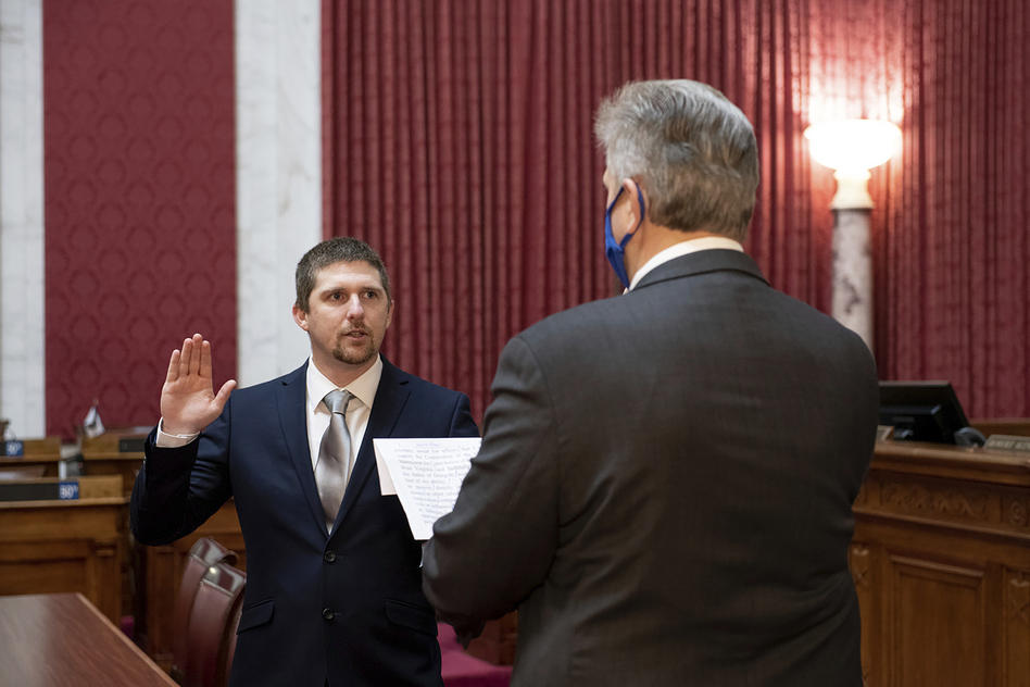 W. Va. Del. Derrick Evans, shown taking the oath of office in Charleston on Dec. 14, 2020 was seen in a video as part of the group of pro-Trump rioters who forced their way into the U.S. Capitol on Wednesday. (Perry Bennett/West Virginia Legislature via AP)