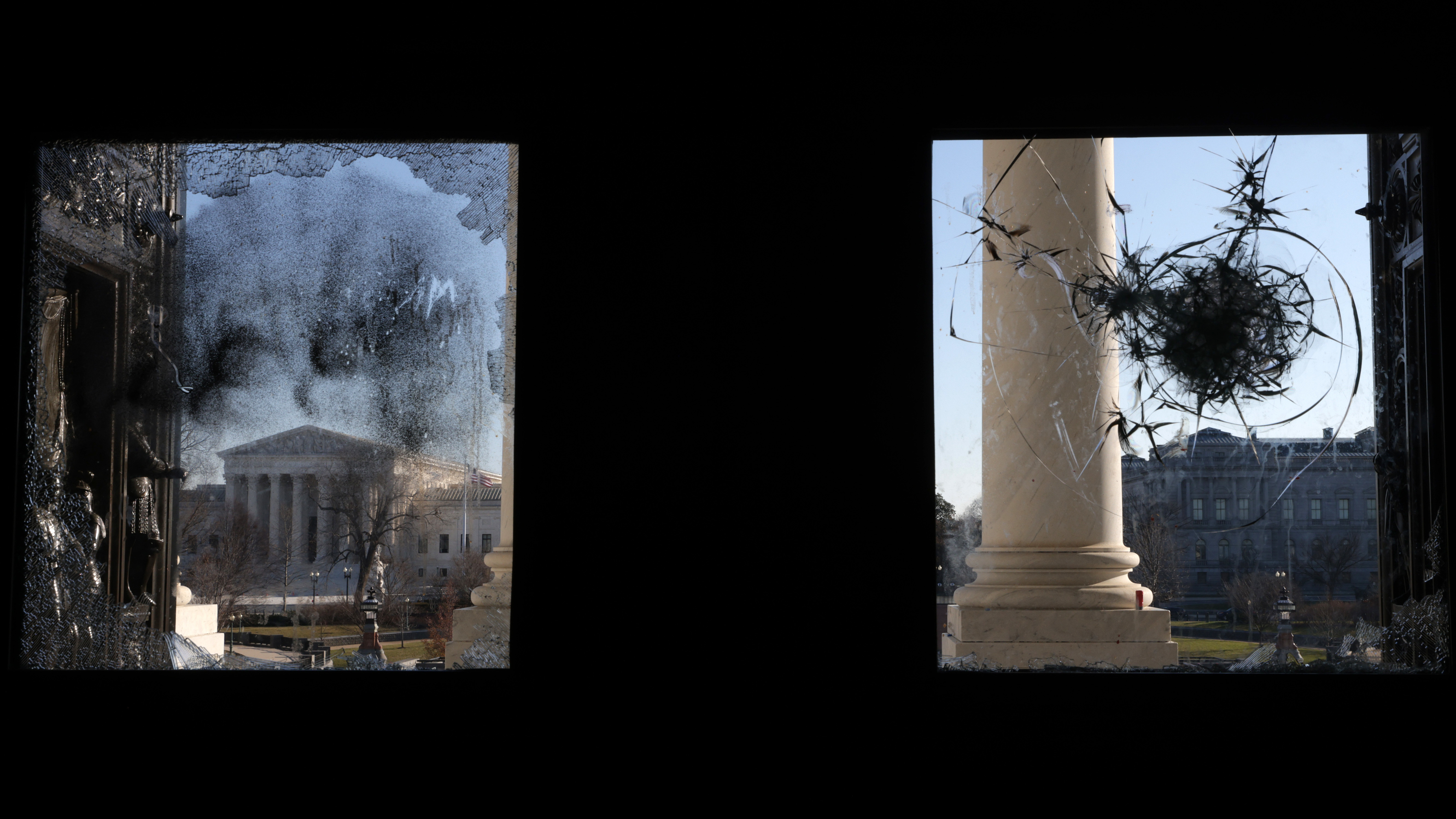 The U.S. Supreme Court is seen through a broken window at an entrance of the U.S. Capitol Wednesday. (Getty Images)