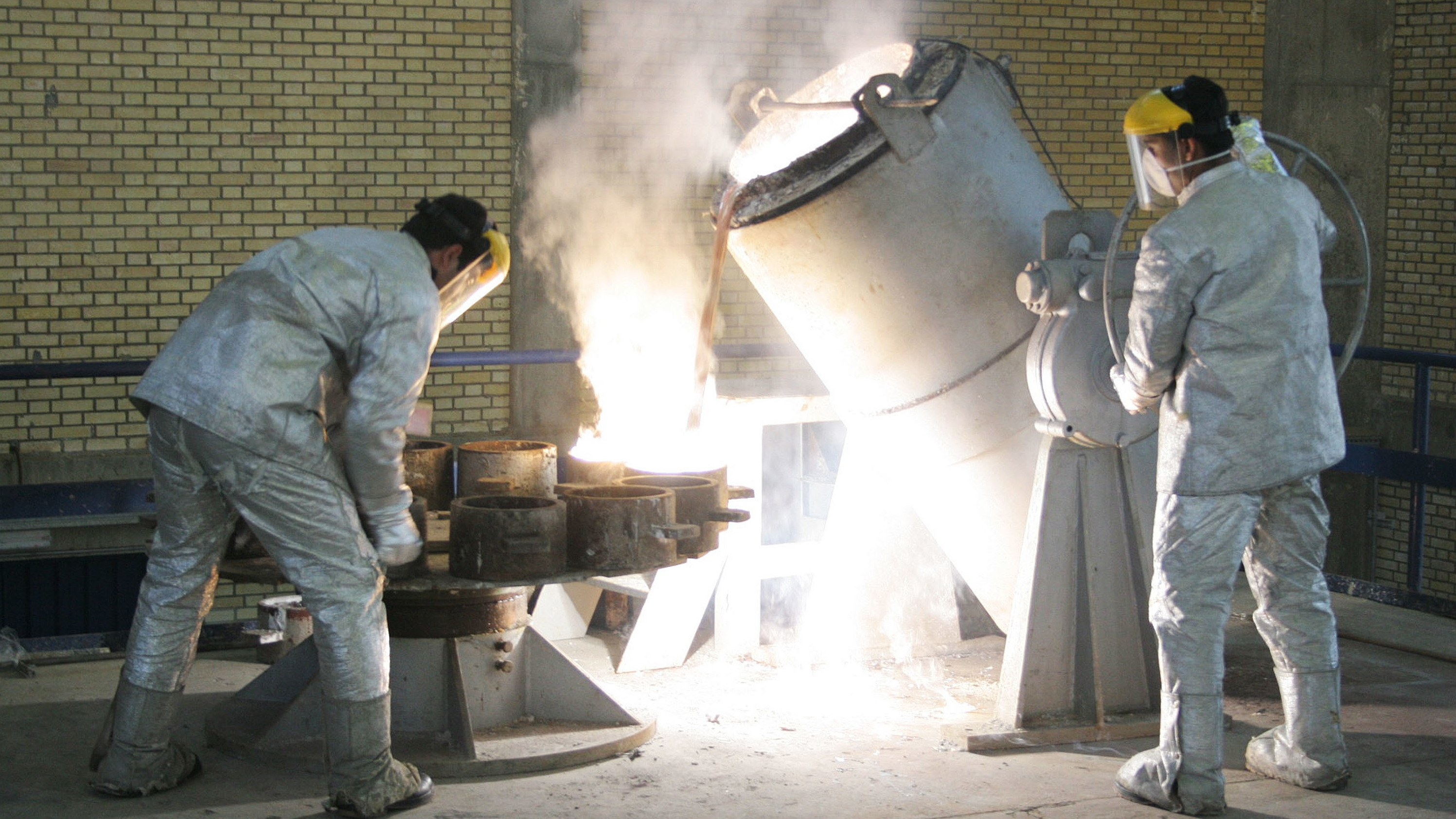 Technicians work inside of a uranium conversion facility producing unit in 2005 outside the city of Isfahan, Iran. After the 2015 Iran nuclear deal put limits on the program, Iran