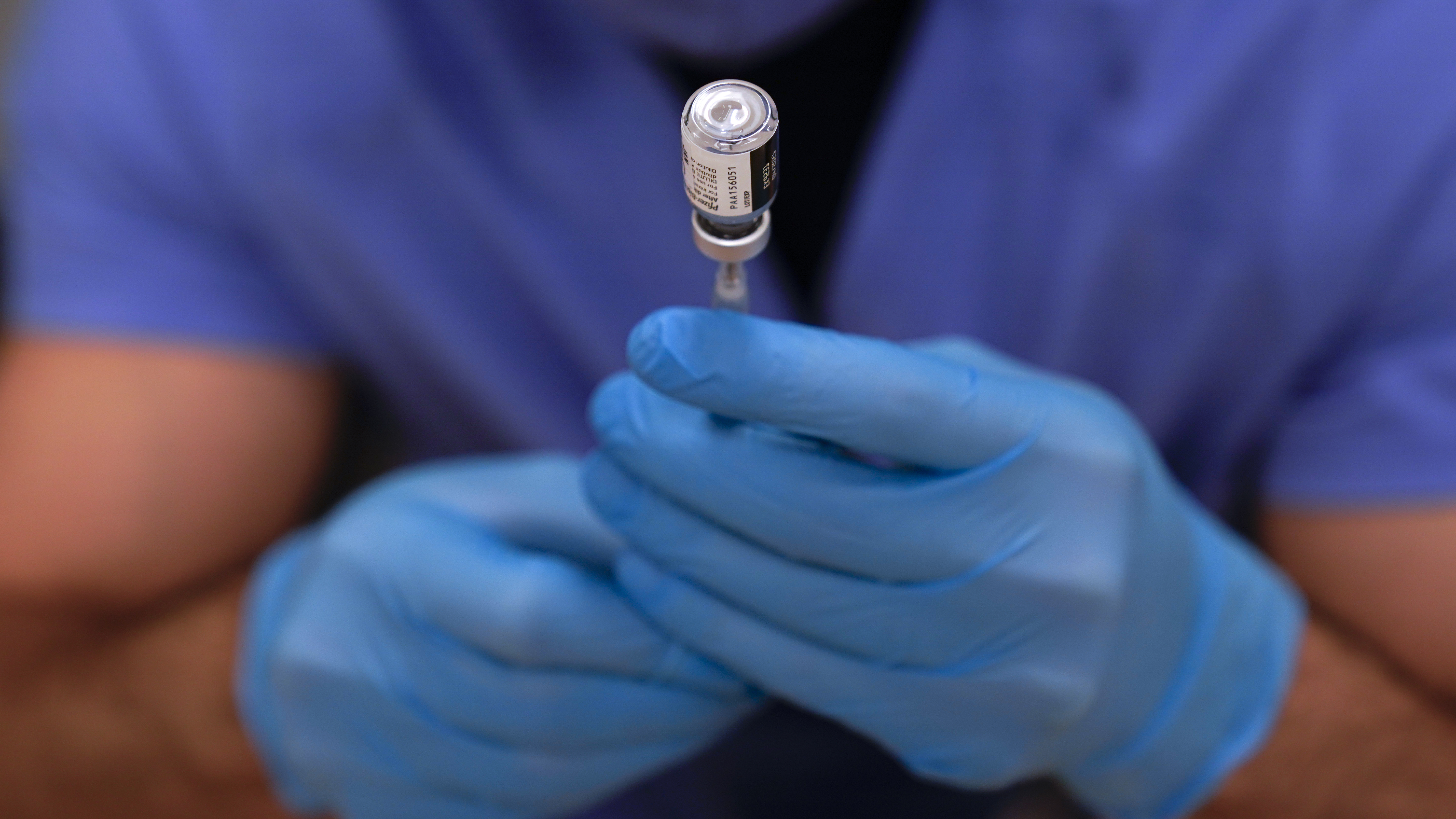 A dose of Pfizer-BioNTech COVID-19 vaccine is prepared in a syringe before a second round of vaccinations were administered at Beaumont Health in Southfield, Mich.