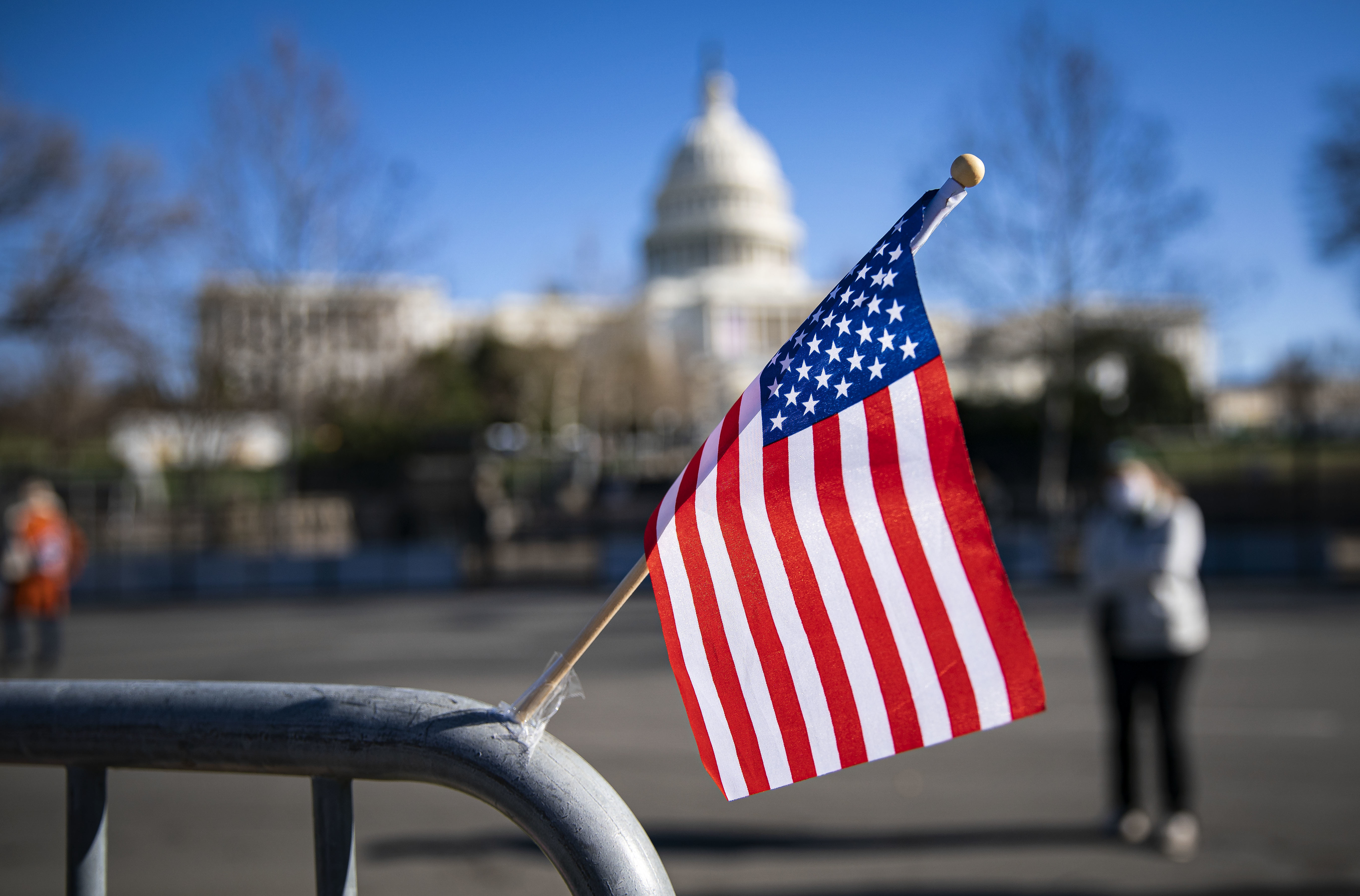 An American flag flies at a memorial for U.S. Capitol Police Officer Brian Sicknick, who was fatally injured when a pro-Trump mob stormed the U.S. Capitol on Wednesday. Another officer, Howard Liebengood, died Saturday in an off-duty death. (Getty Images)