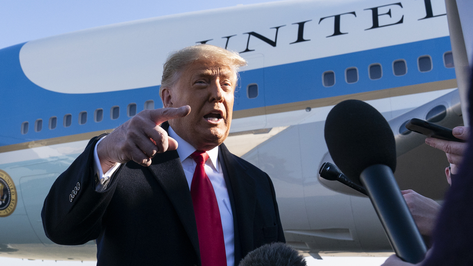 President Trump speaks to reporters before boarding Air Force One on Tuesday. Trump denied culpability for the violence and expressed no regret for comments made last week that many have criticized as being a catalyst for mob violence at the U.S. Capitol. (Alex Brandon/AP)