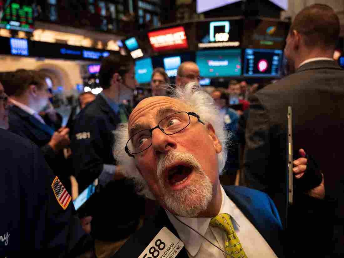 TOPSHOT - Traders work after the opening bell at the New York Stock Exchange (NYSE), while logo for Pinterest Inc. is pictured on the screens during the company's IPO on April 18, 2019 in New York City. (Photo by Johannes EISELE / AFP) (Photo by JOHANNES EISELE/AFP via Getty Images)
