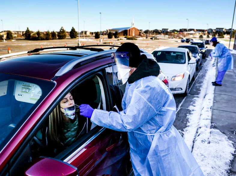 A coronavirus variant that is thought to be more contagious was detected in the United States in Elbert County, Colo., not far from this testing site in Parker, Colo. The variant has been detected in several U.S. states. (Michael Ciaglo/Getty Images)