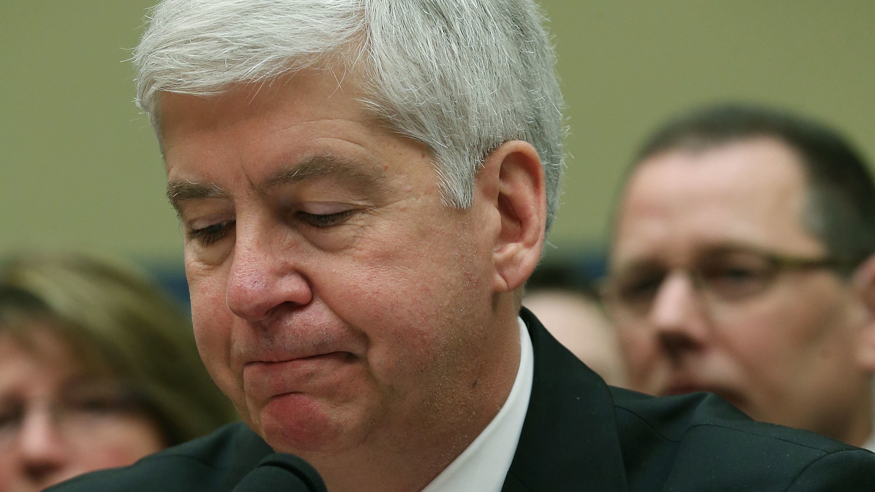 Now Former Michigan Gov. Rick Snyder, (R-MI), listens to Congressional members remarks during a House Oversight and Government Reform Committee hearing, about the Flint, Mich. water crisis in 2016.