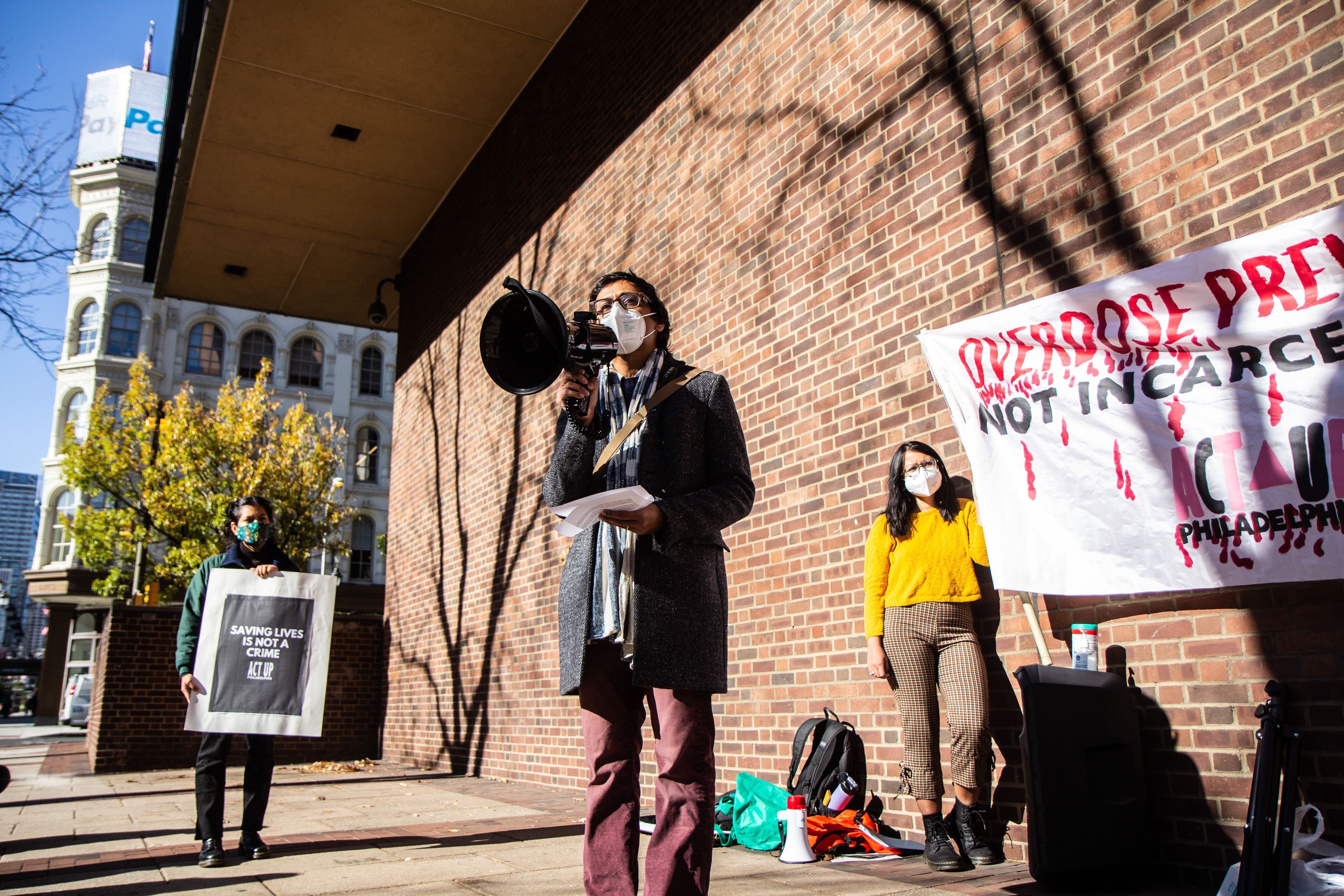 Nikil Saval, a newly elected Pennsylvania state senator, speaks in support of opening a &quot;supervised injection site&quot; for opioid users in Philadelphia during a Nov. 16 rally outside the federal courthouse. (WHYY)