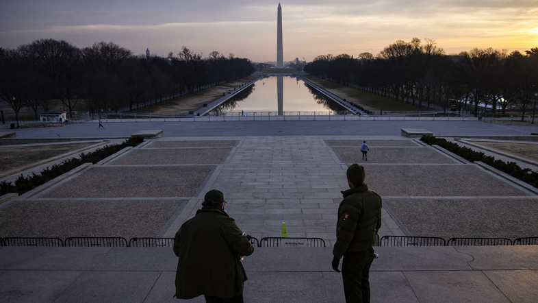 U.S. park rangers look at the spot where the Rev. Martin Luther King Jr. gave his famous &quot;I Have a Dream&quot; speech on the steps of the Lincoln Memorial in Washington, D.C., on Friday. Security threats have prompted officials to shut down the National Mall and much of downtown Washington, D.C. (Samuel Corum/Getty Images)