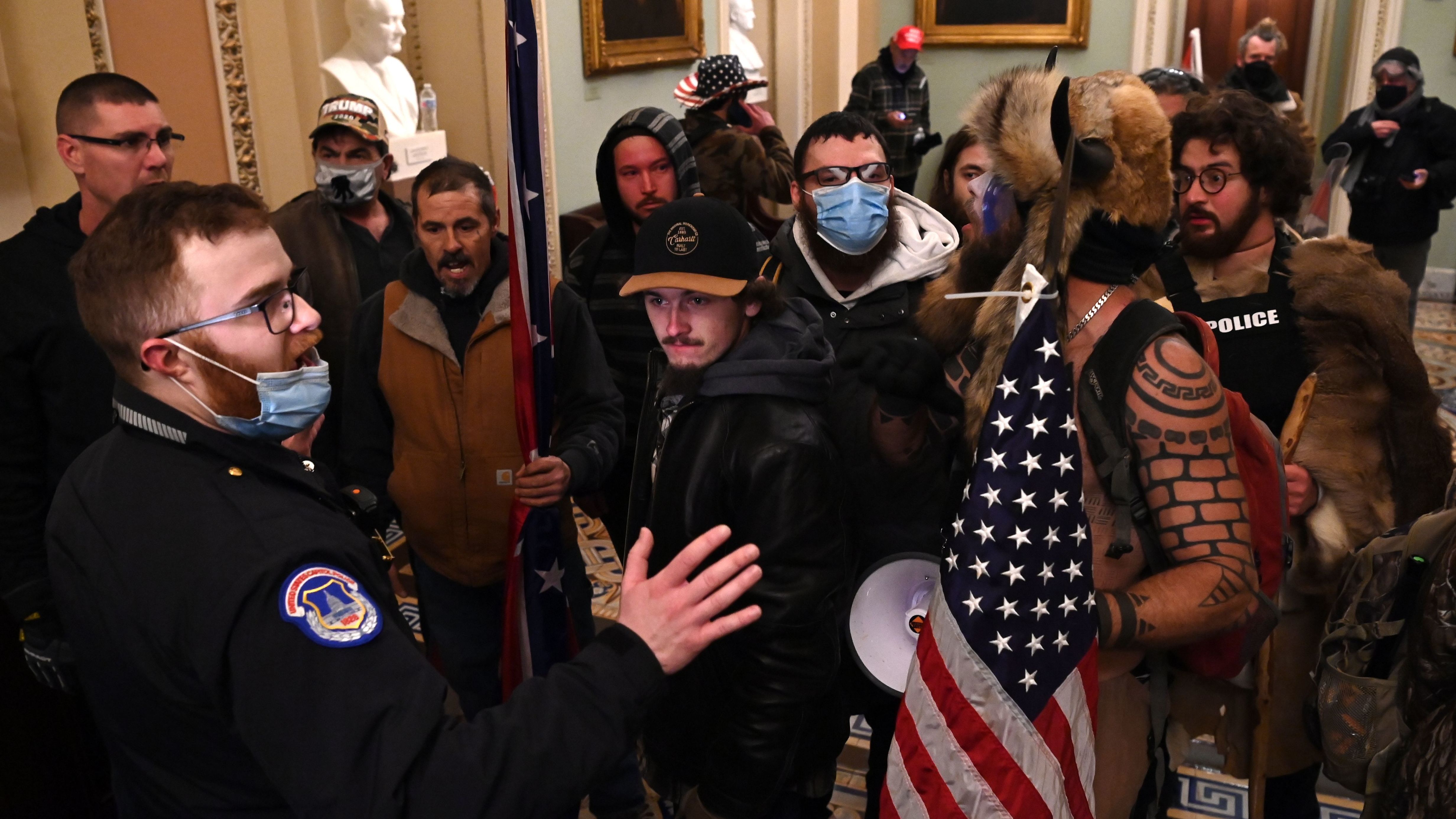 Jacob Chansley, the &quot;QAnon Shaman&quot; known for his painted face and horned hat, was taken into custody in Arizona in connection with the assault on the U.S. Capitol on Jan 6. (AFP via Getty Images)