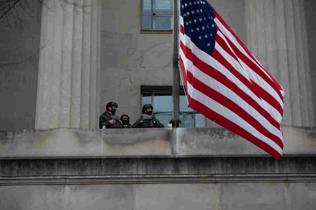 The National Guard keep watch from the U.S. Capitol.