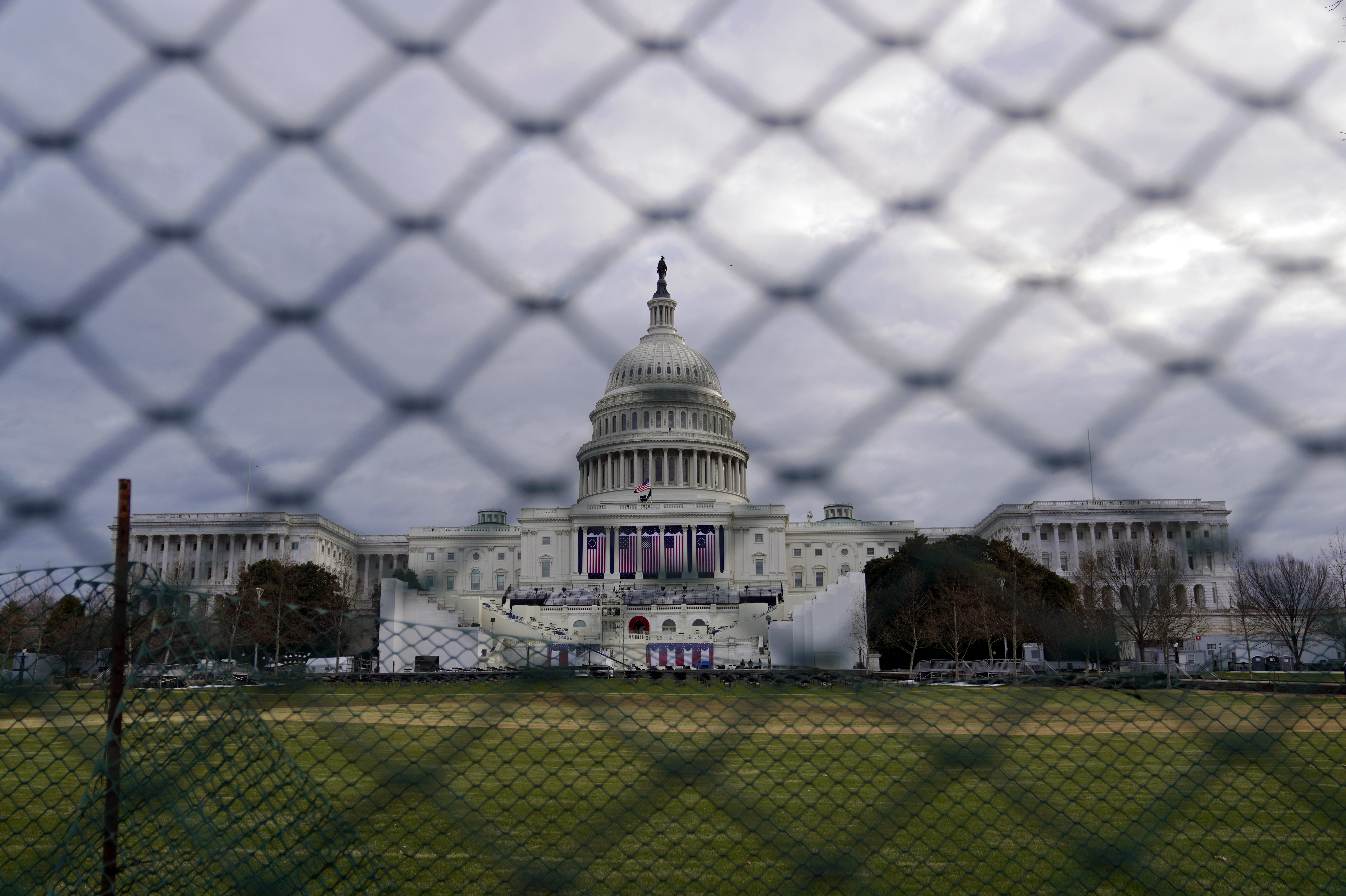 The U.S. Capitol is visible behind fences on Sunday following the Jan. 6 riot by pro-Trump extremists. This week's events will have the largest security presence of any inauguration in U.S. history. (Getty Images)