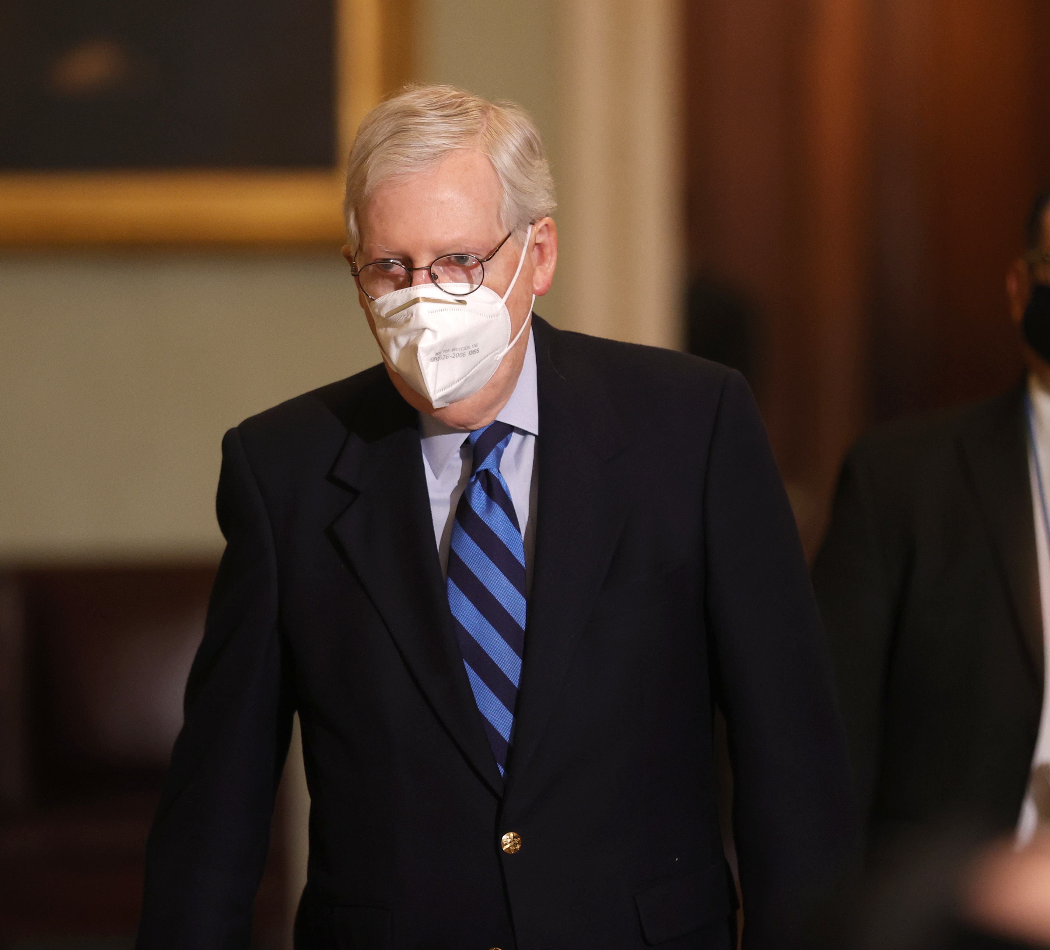 Senate Majority Leader Mitch McConnell leaves the Senate chamber on Tuesday. In remarks, he publicly denounced President Trump for instigating the Jan. 6 insurrection on the Capitol. (Getty Images)