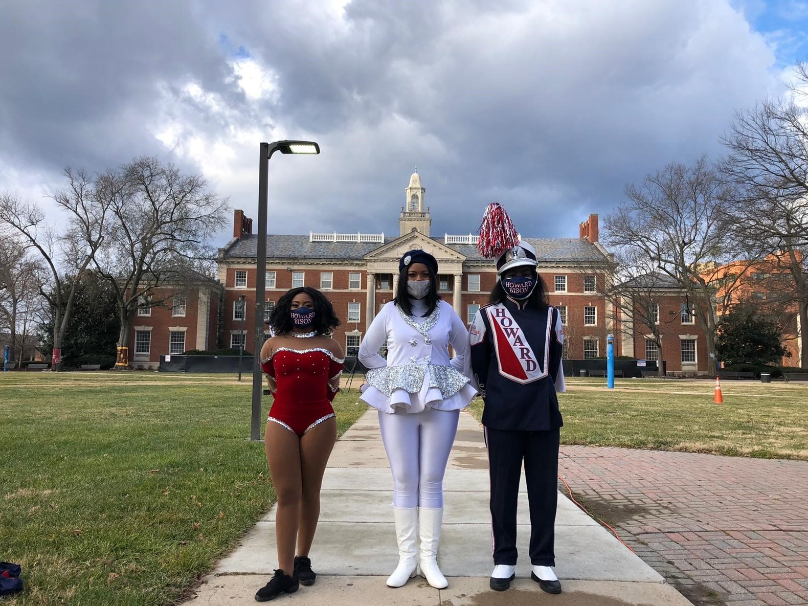 Howard University students (from left) Ayanna Snead, Cheyne Thompson-Quartey and Paula Clark get ready to perform in Wednesday's inaugural parade. (NPR)