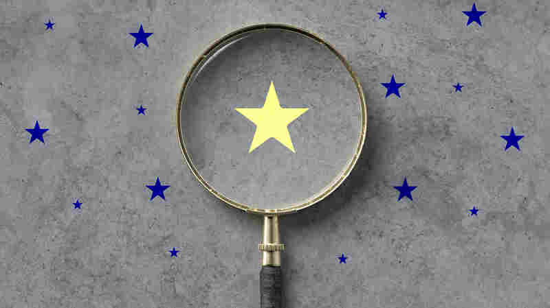 magnifying glass with a yellow star mark as symbol for finding a solution on concrete background - 3d illustration