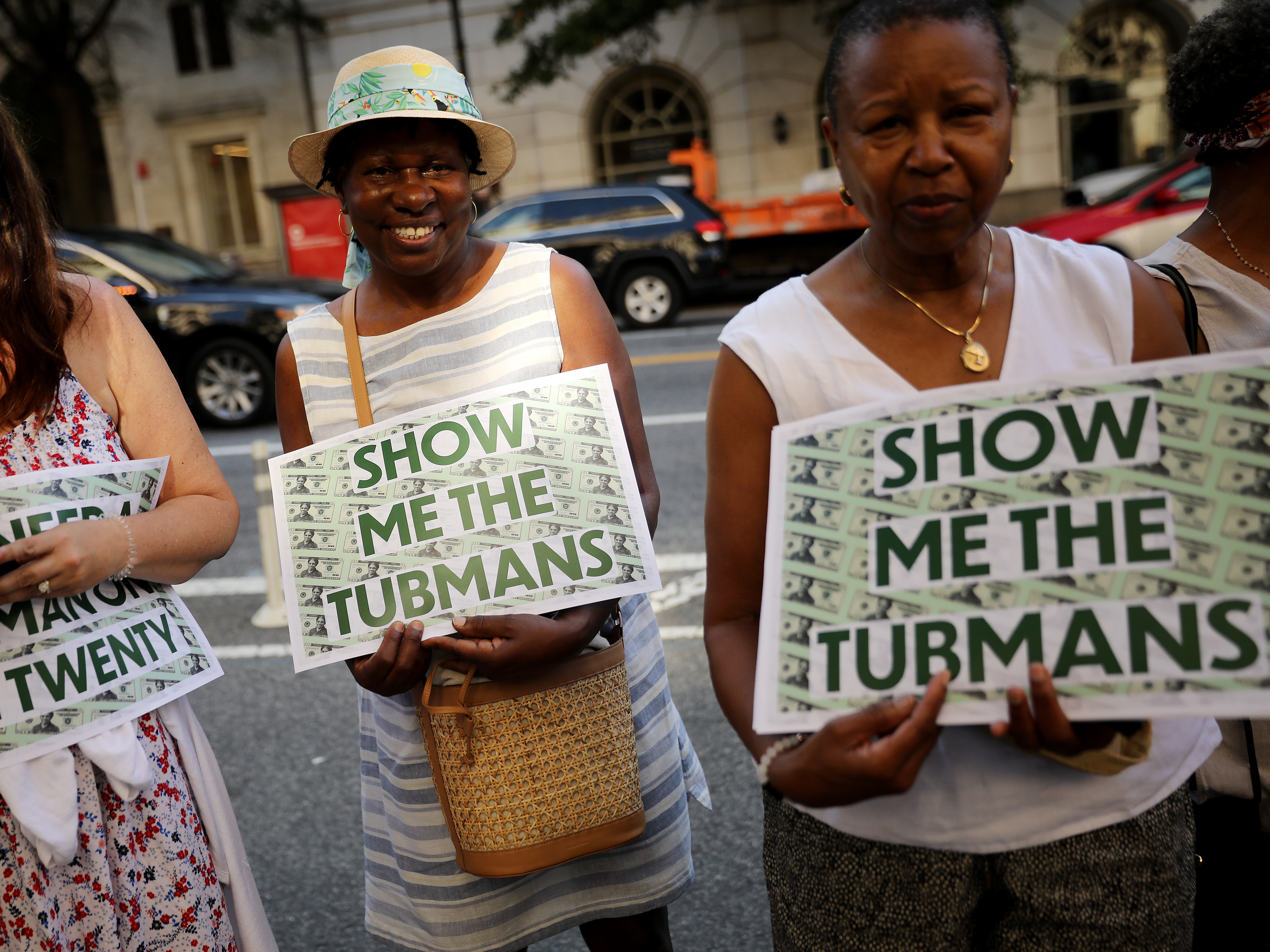 Supporters rally outside the U.S. Treasury Department in 2019 to demand that American abolitionist Harriet Tubman's image be put on the $20 bill. (Getty Images)