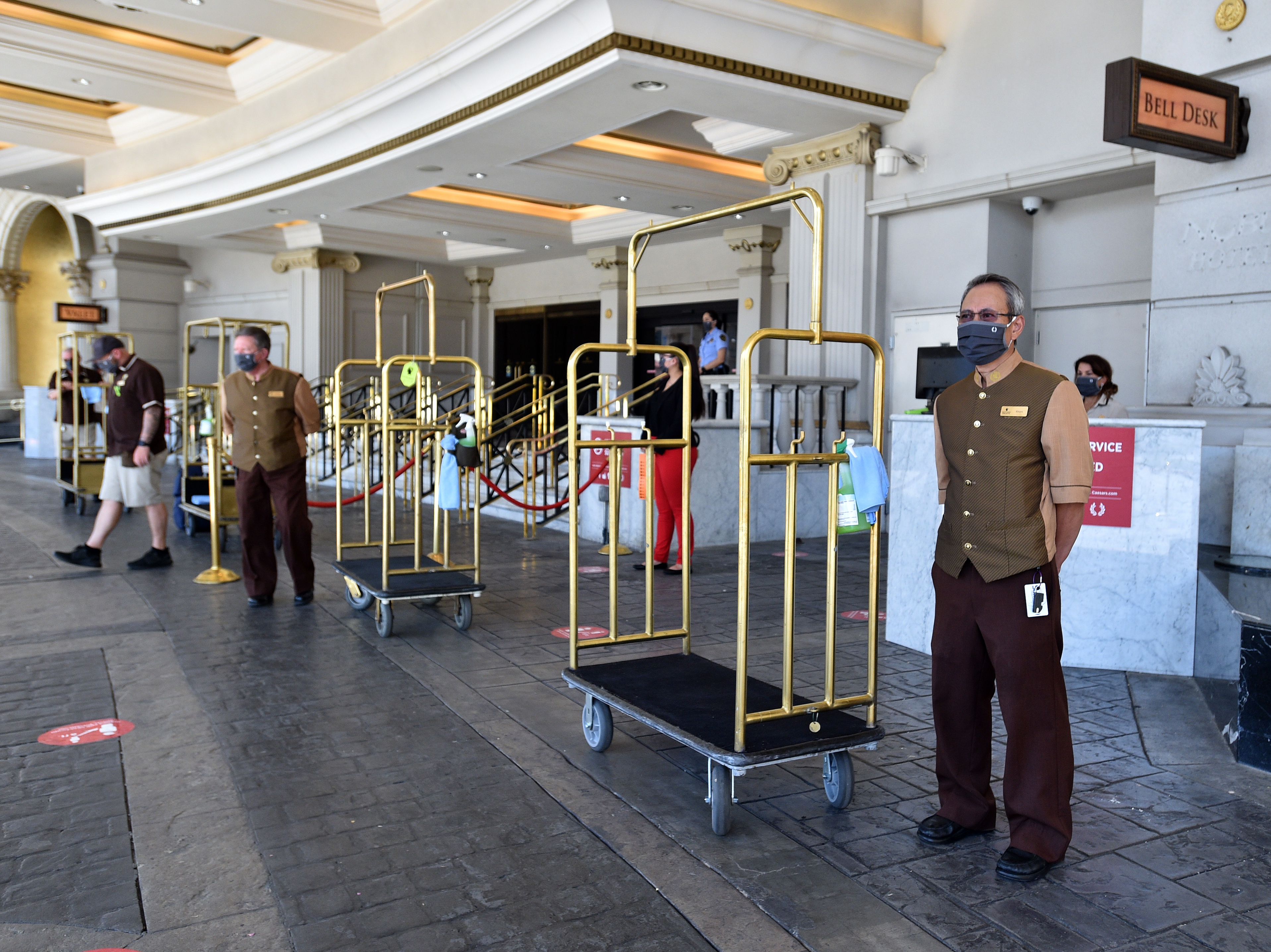 Hotel staff stand ready to receive guests on June 4, 2020, at Caesars Palace in Las Vegas. U.S. hotels hit all-time lows in occupancy and in revenue per available room last year. (Getty Images)