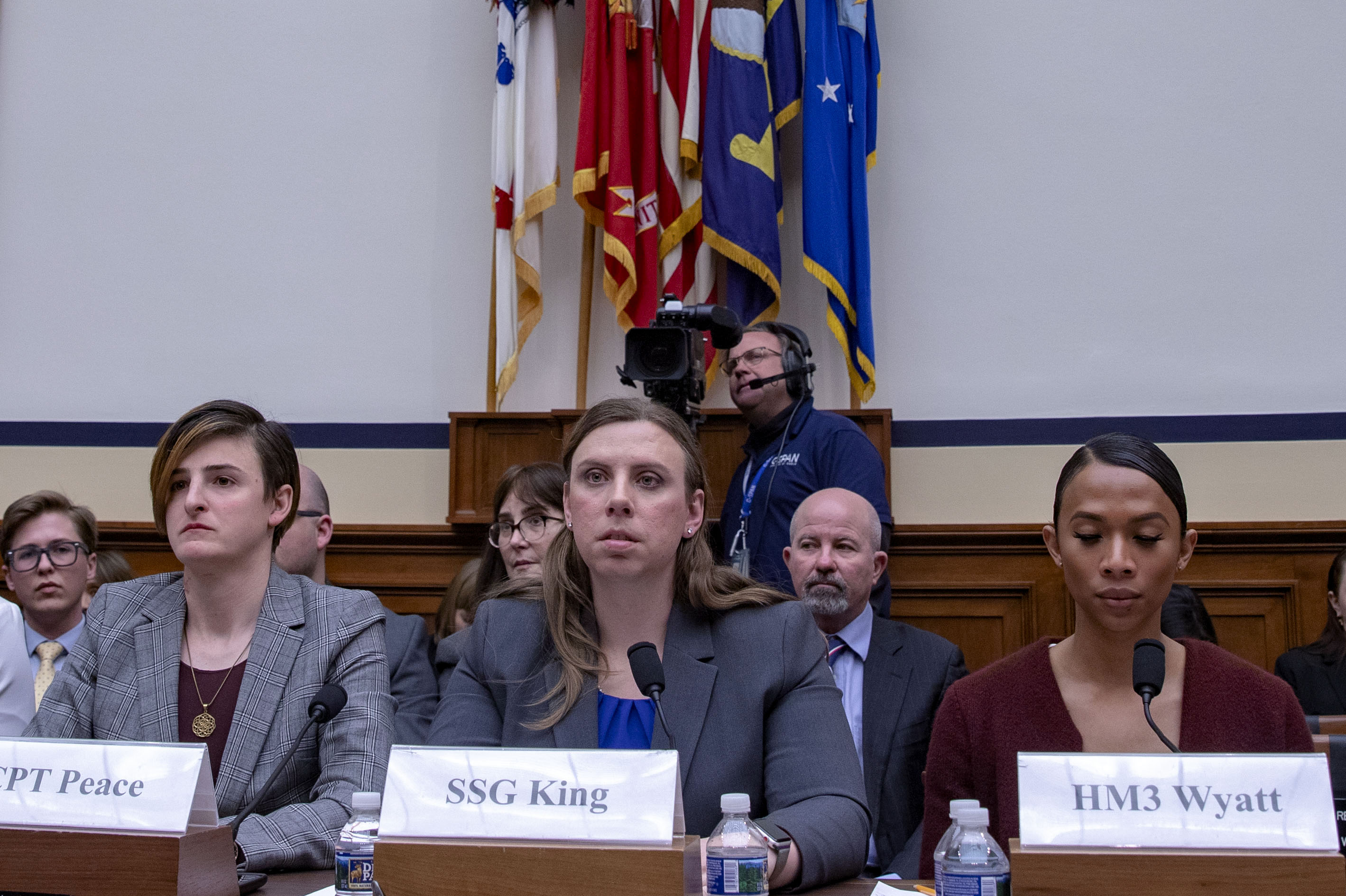 Army Capt. Jennifer Peace, Army Staff Sgt. Patricia King (center) and Navy Petty Officer 3rd Class Akira Wyatt attend a hearing on Transgender Service Policy on Capitol Hill in 2019. King and other trans troops have long fought for the right to serve openly prior to Trump's ban, and she hopes there is more legislation to follow Biden's repeal to ensure something like that does not happen again. (Getty Images)