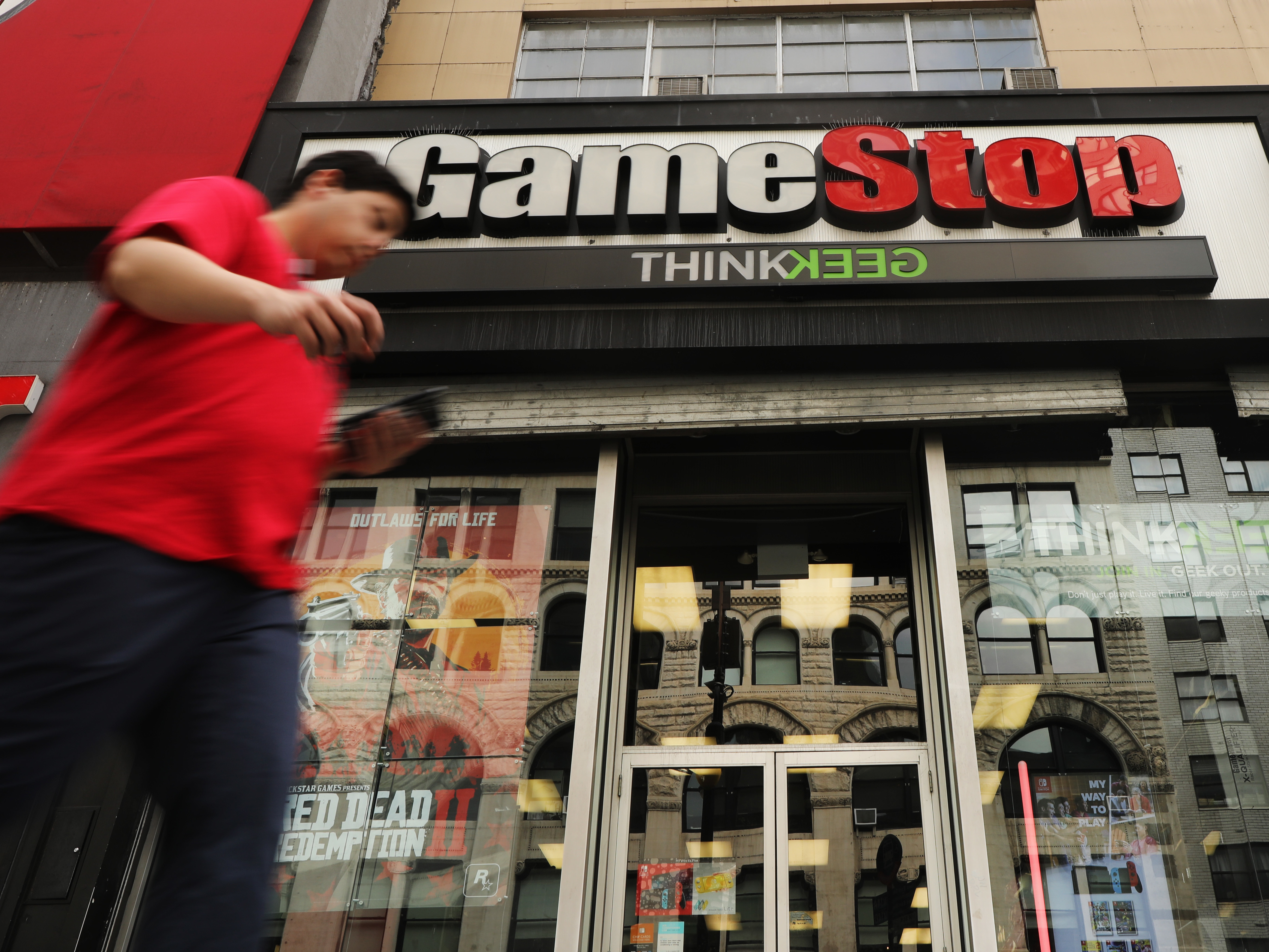 Video game retailer GameStop has seen its stock soar, driven higher by a group of amateur day traders on Reddit, who are taking on Wall Street hedge funds. The frenzy has gotten the attention of regulators and lawmakers. (Getty Images)