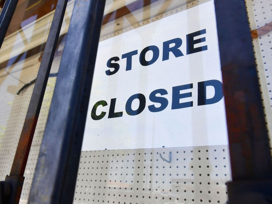 The U.S. economy slowed sharply in the last three months of the year from the previous quarter as the pandemic made a resurgence and businesses had to close. (Frederic J. Brown/AFP via Getty Images)