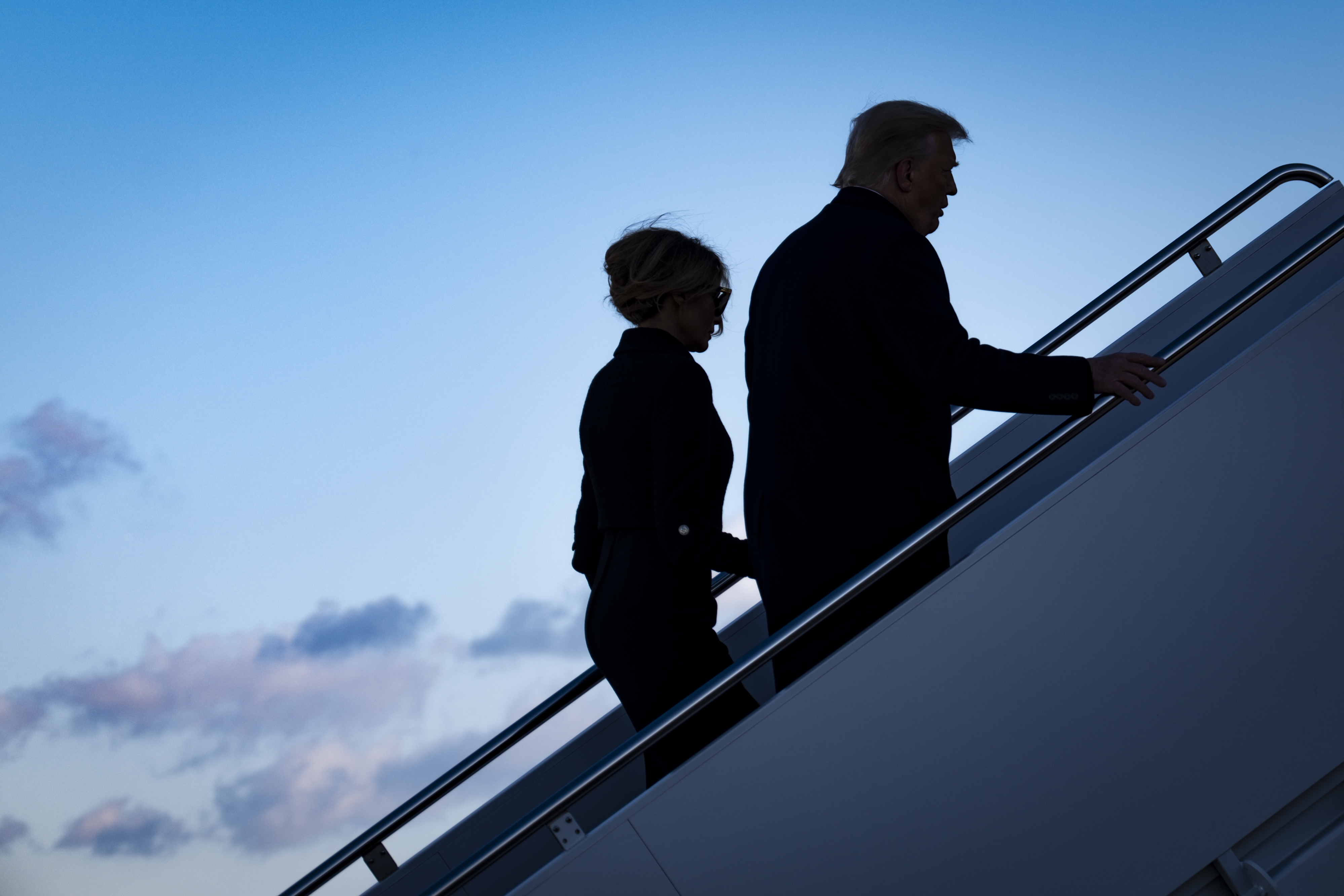 Leaving Washington, D.C., behind, the Trumps board Air Force One at Joint Base Andrews in Maryland on Jan. 20, hours before President Biden's inauguration. (Pool/Getty Images)