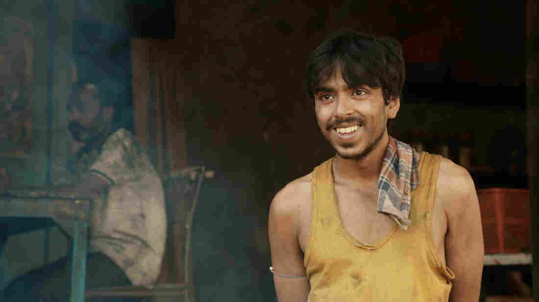 He is "the white tiger" — a poor villager, Balram, portrayed by actor Adarsh Gourav, who is determined to use his intelligence to escape a life of poverty.