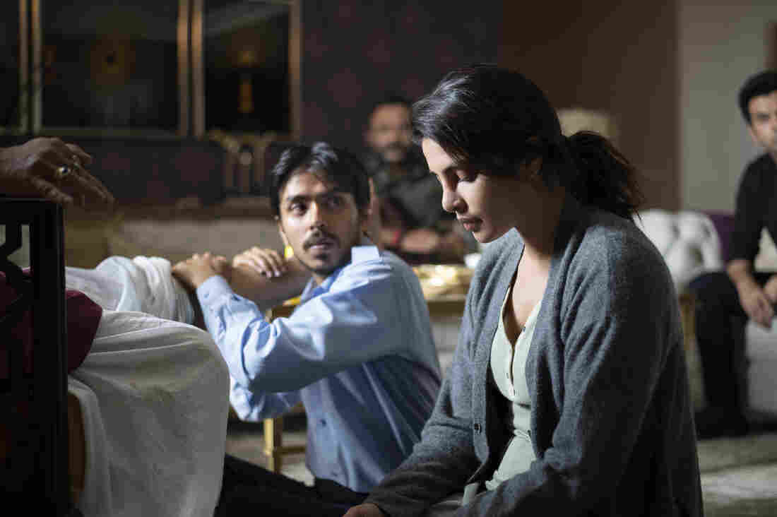 As the driver for a rich couple, Balram is tasked with massaging the tired legs of his boss Ashok (Rajkummar Rao) while his wife Pinky (Priyanka Chopra Jonas) looks on. Jonas, was one of the producers for the film, which chronicles Balram's attempt to rise out of poverty.