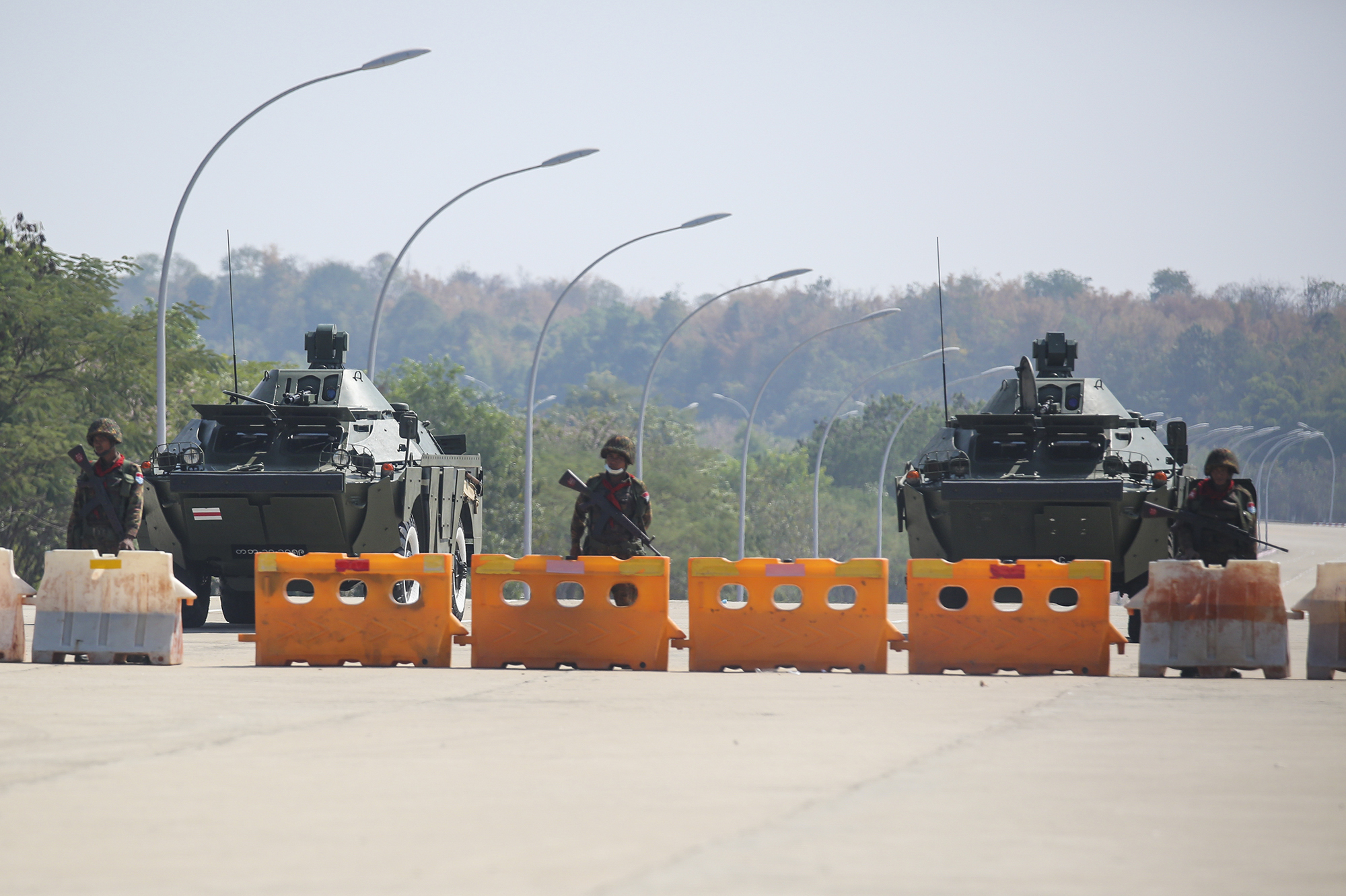 Troops block the road near parliament in Naypyitaw, capital of Myanmar. Myanmar's military announced Monday that it has seized power and will rule the country for at least one year after detaining its top political leaders. (Anadolu Agency via Getty Images)