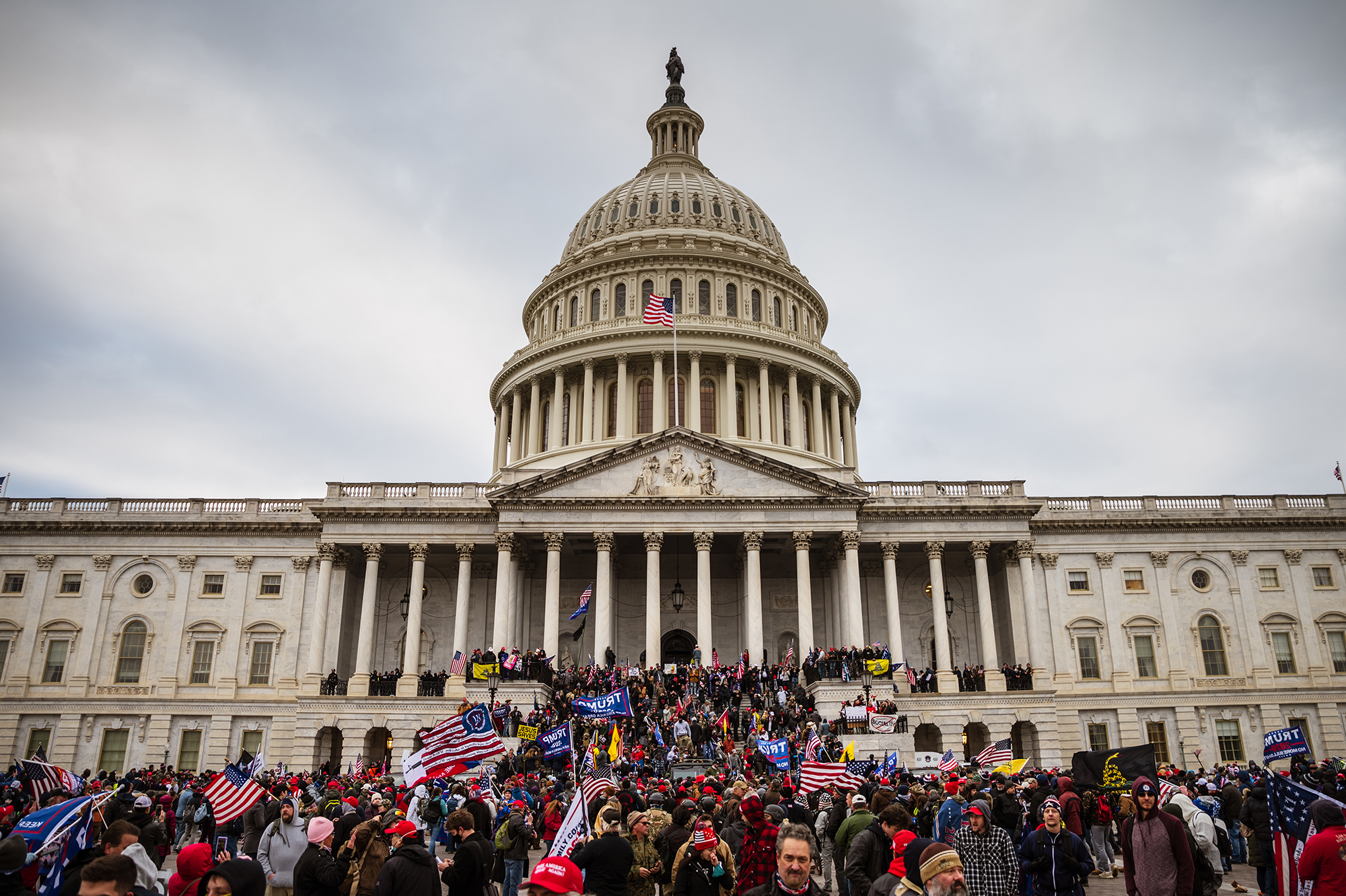 A large group of pro-Trump extremists stands on the east steps of the Capitol after storming its grounds on Jan. 6. A pro-Trump mob stormed the Capitol that day, breaking windows and clashing with police officers to protest the 2020 election results. (Getty Images)