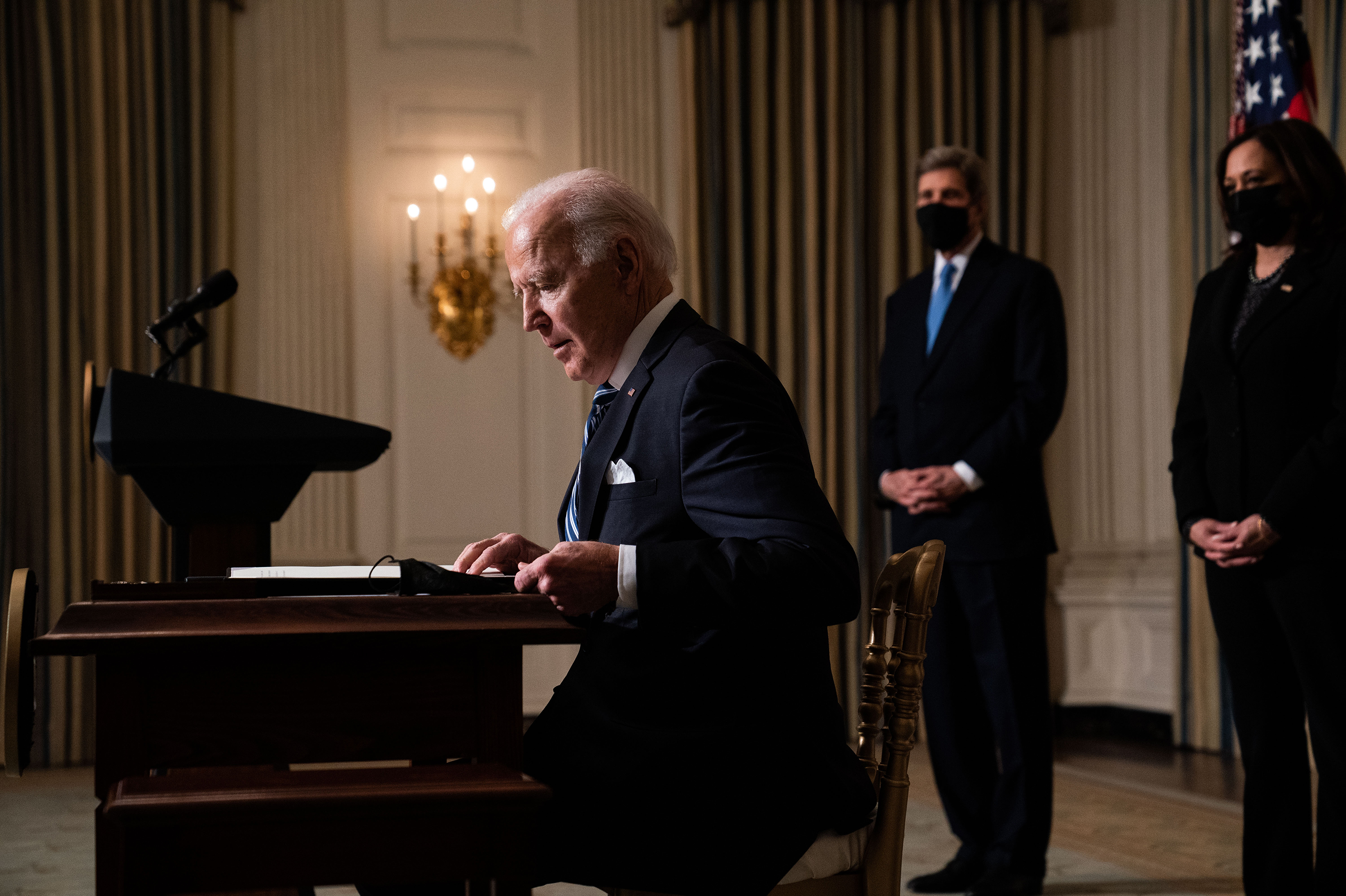 President Biden prepares to sign executive orders after speaking about climate change issues in the State Dining Room of the White House on Jan. 27. (Getty Images)