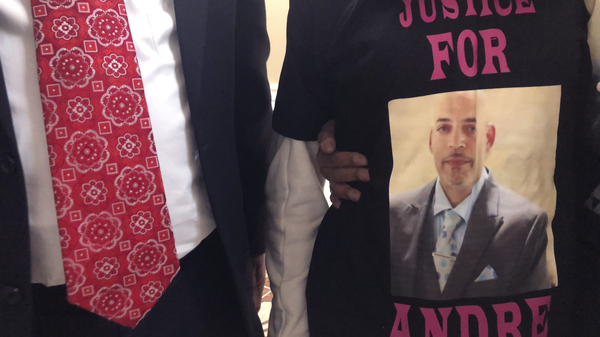 Andre Hill, fatally shot by Columbus, Ohio, police on Dec. 22, is memorialized on a shirt worn by his daughter, Karissa Hill. A white officer was indicted Wednesday on murder charges.